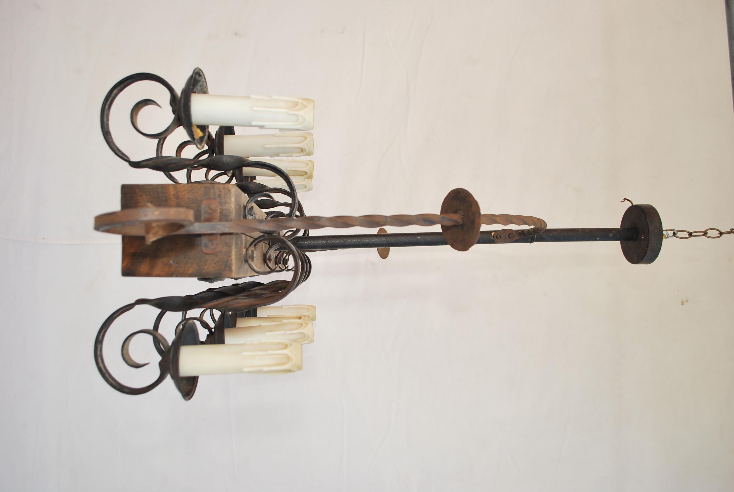 Mid-20th Century Elegant 1940's Wood and Iron Chandelier For Sale