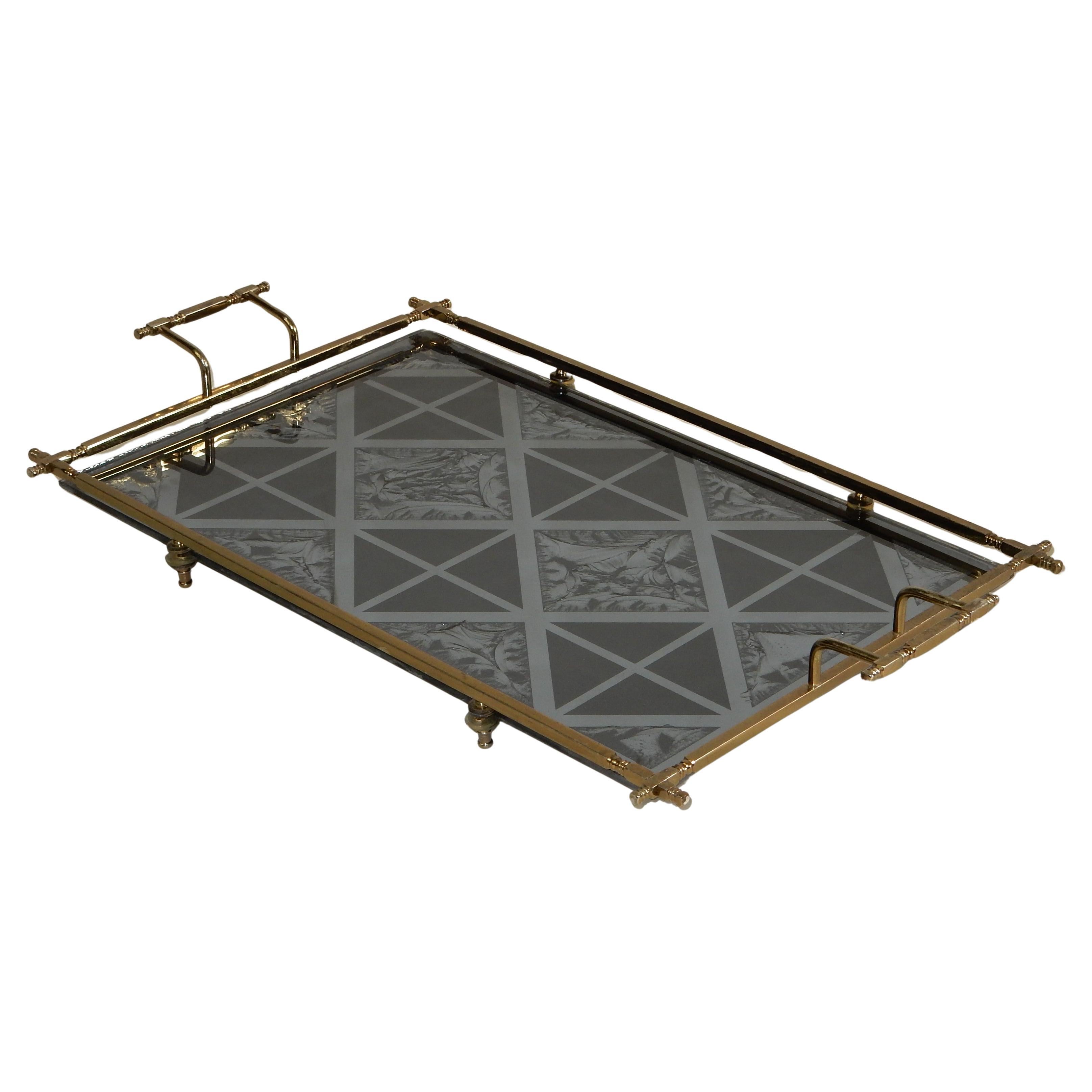 1950's Italian footed vanity tray with reverse painted design on glass.
(Line in upper left corner of 1st photo is a reflection)
Brass finished frame with intricate joints.
Ideal for a perfume collection on your vanity.
Aged patina throughout. 