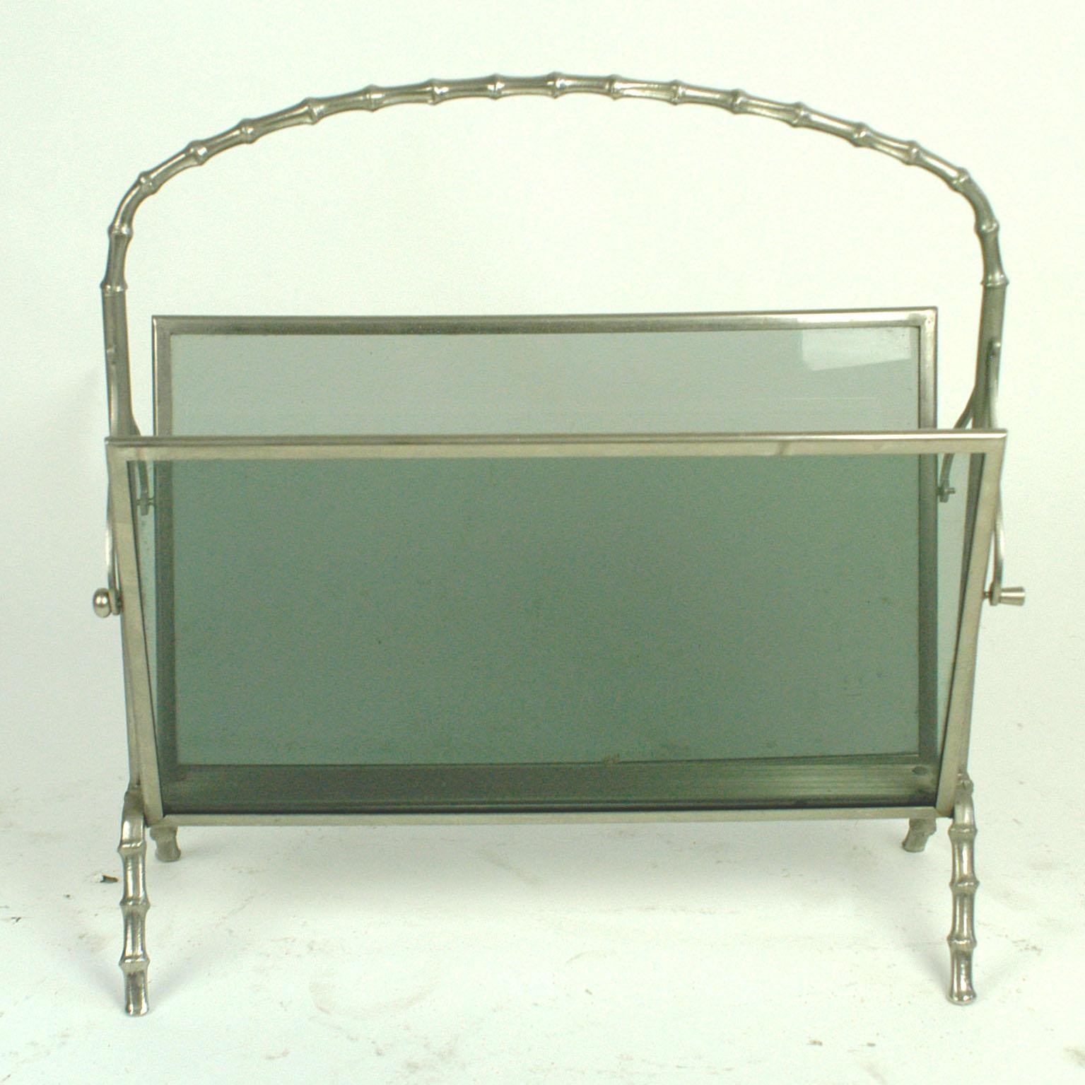 Elegant silvered brass magazine rack by Maison Baguès, Paris, France with bamboo shaped handle and legs, smoked grey glass. Manufactured circa 1960.