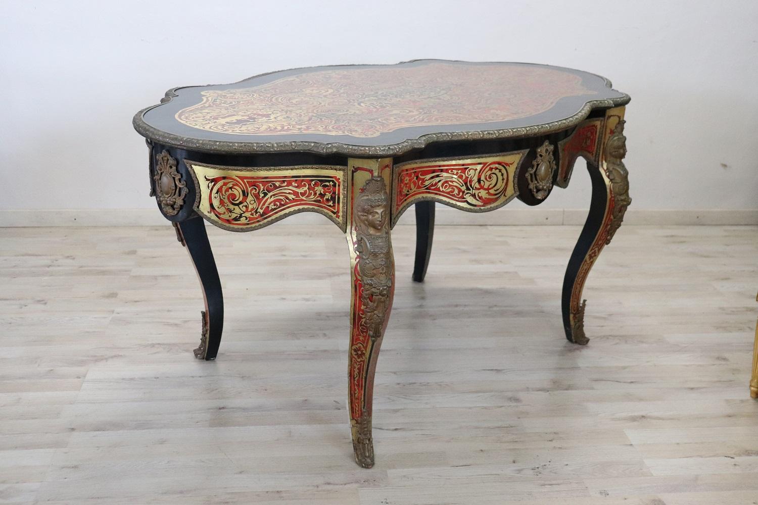 Rare and fine quality Napoleon III French kidney shaped centre table and desk with overall Boulle work. Great quality of cabinet-making, the rich inlay work with gilded bronze covers every part of the piece of furniture. Many decorative elements in