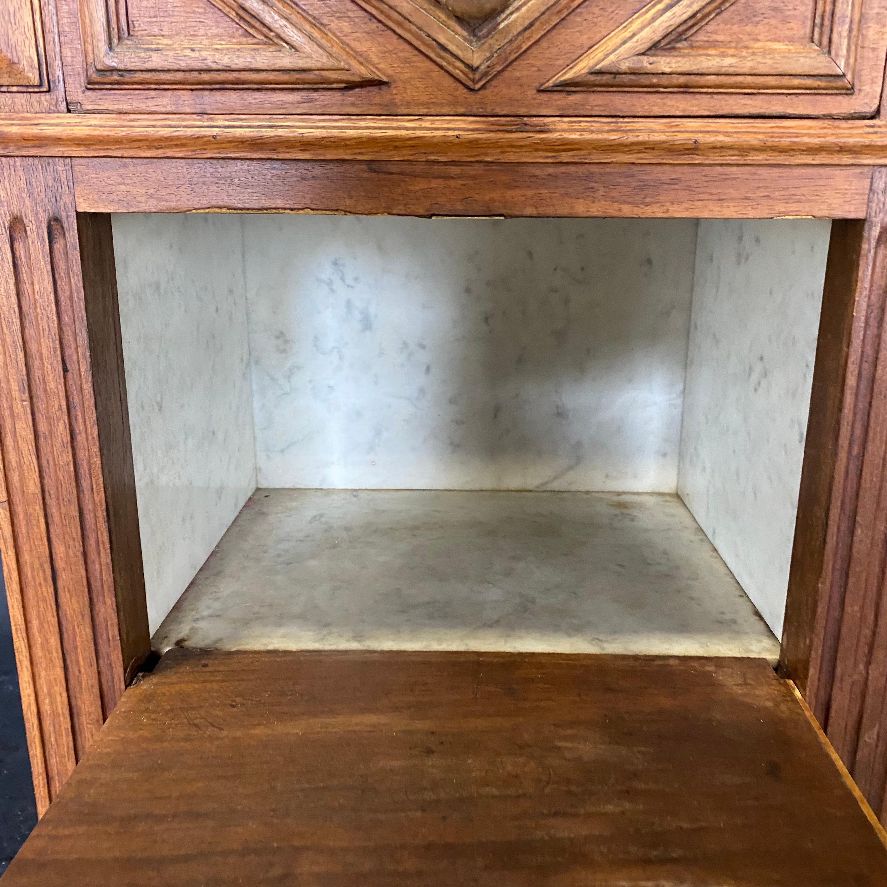 This lovely and functional French oak marble top cabinet can be used as a linen chest, bedside cabinet, nightstand, or side table. The interior compartment is lined with the same carrara marble as the top. Top drawer is accented with diamond