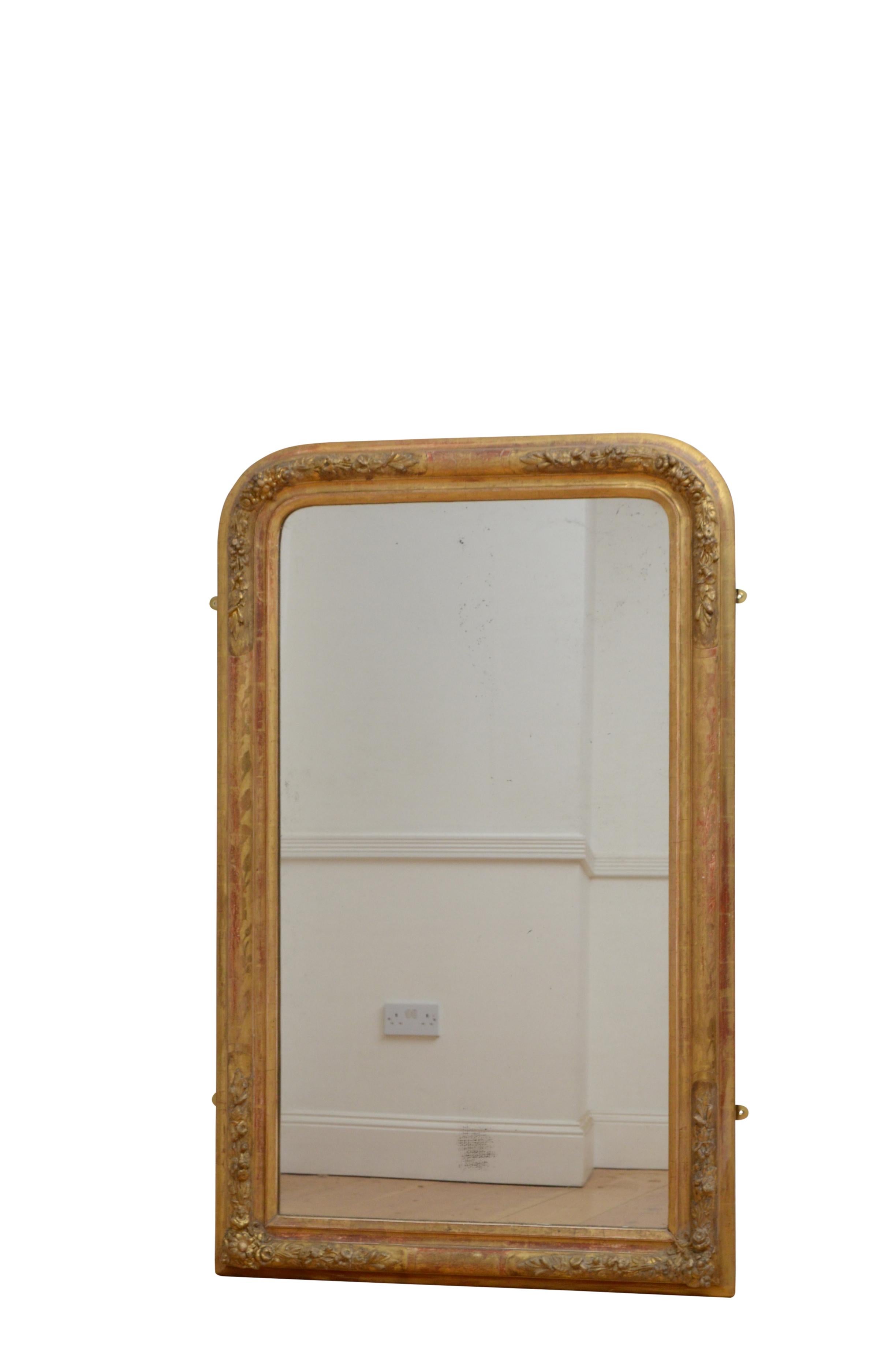 Fine XIXth century giltwood pier mirror, having original mercury glass with some foxing in gilded frame with carved floral decoration to corners and etchings throughout. This antique mirror retains its original glass with some foxing original gilt