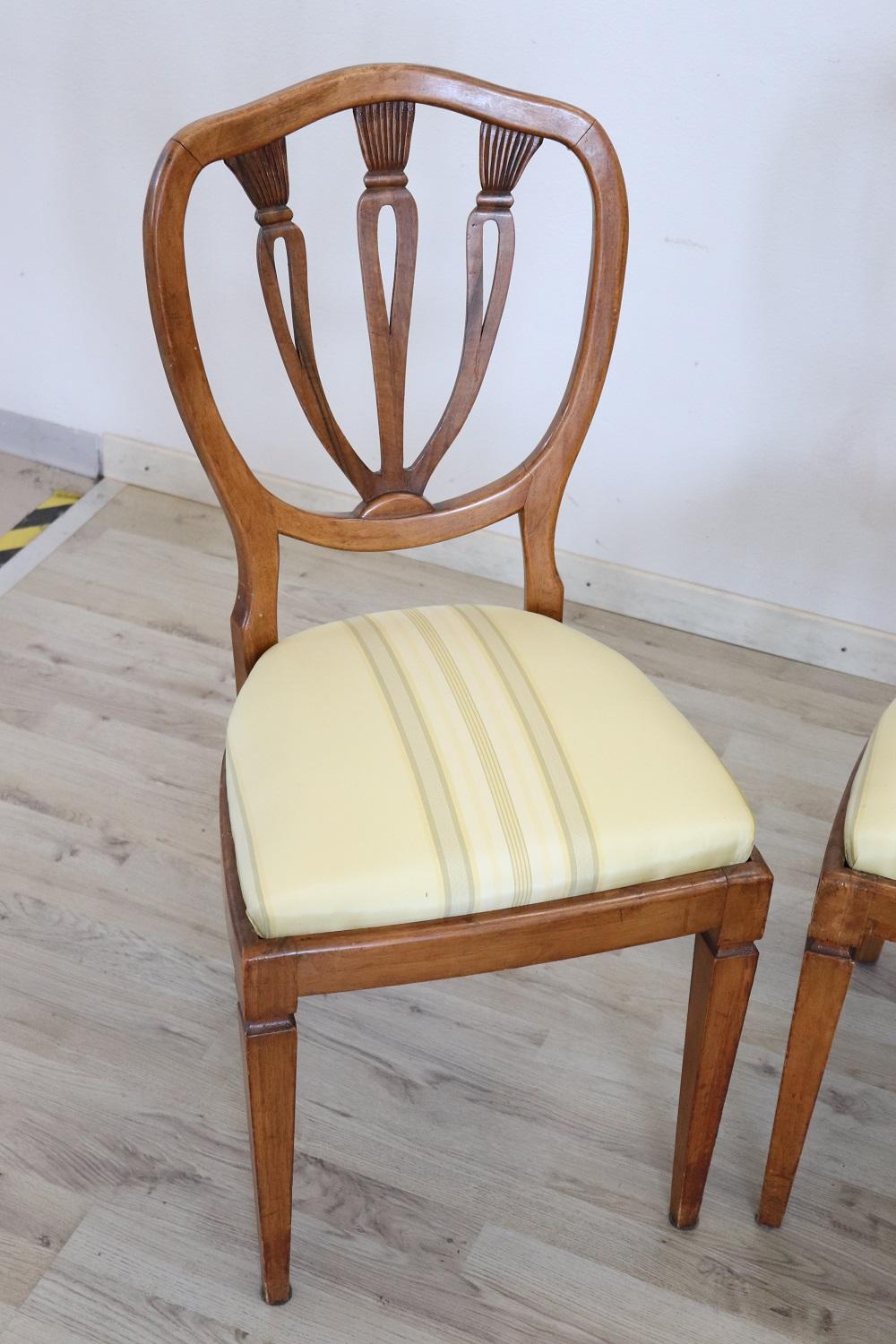 Series of eight refined 19th century authentic Italian walnut wood chairs. Refined decoration the back is carved. The legs are very elegant straight. The seat is wide and comfortable with fine silk lining. The silk lining is used, it has some small