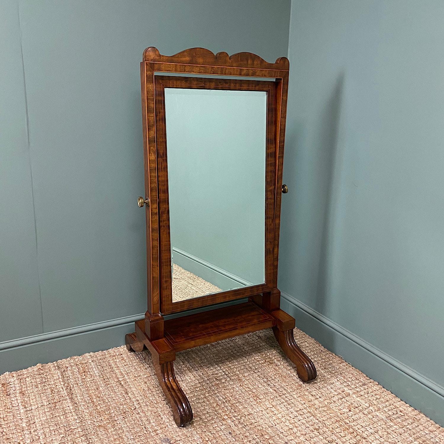 Elegant Small Victorian Inlaid Antique Cheval Mirror

This Elegant 19th century Small Victorian Inlaid Antique Cheval Mirror dates from circa, 1850 and has a shaped pediment above the original tilting bevelled mirror, beautifully cross-banded and