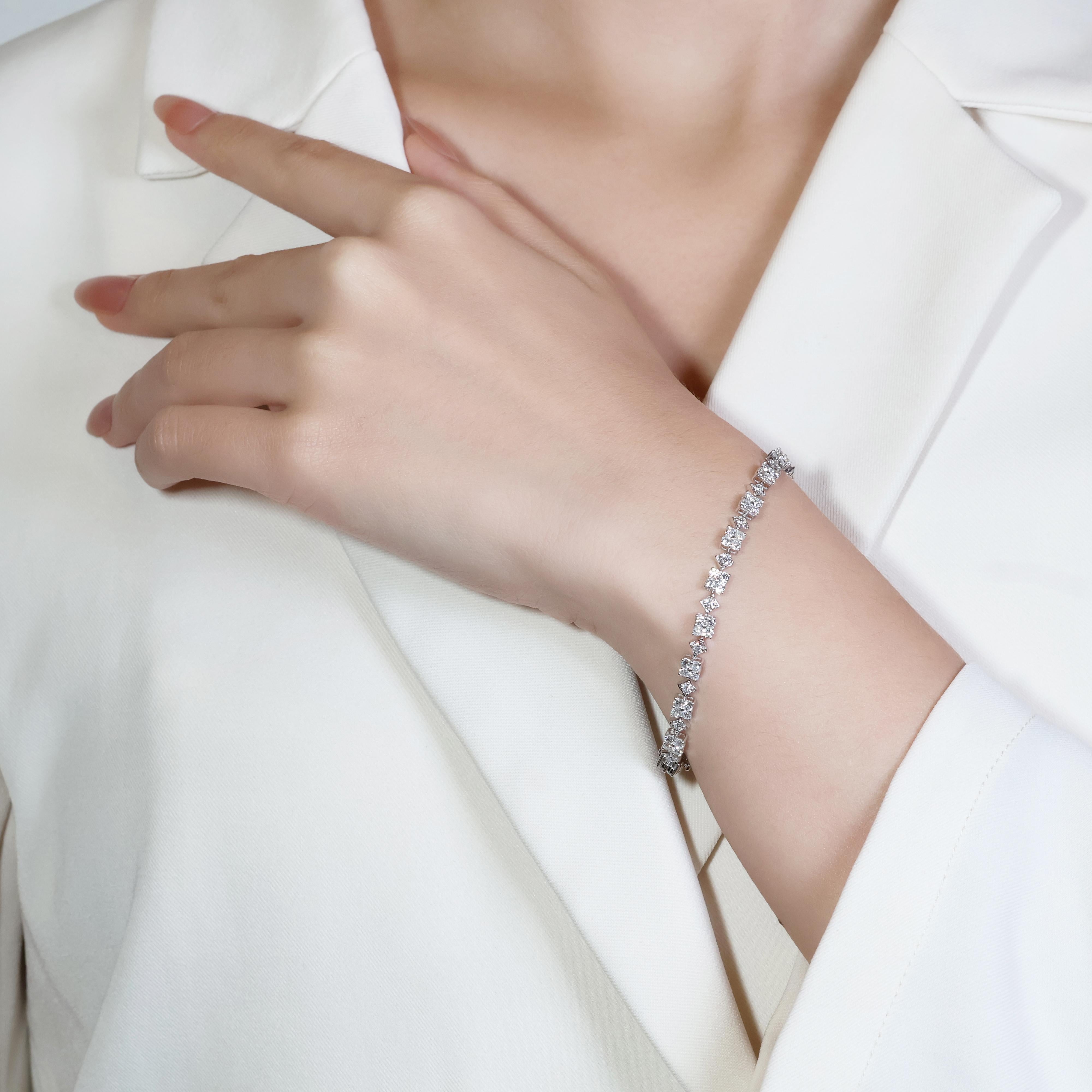 Introducing a stunning 18K white gold bracelet, meticulously set with 90 round brilliant diamonds, totalling an impressive 2.7 carats. These diamonds, with a color grade of H, are near colorless, ensuring exceptional brilliance and fire. The clarity