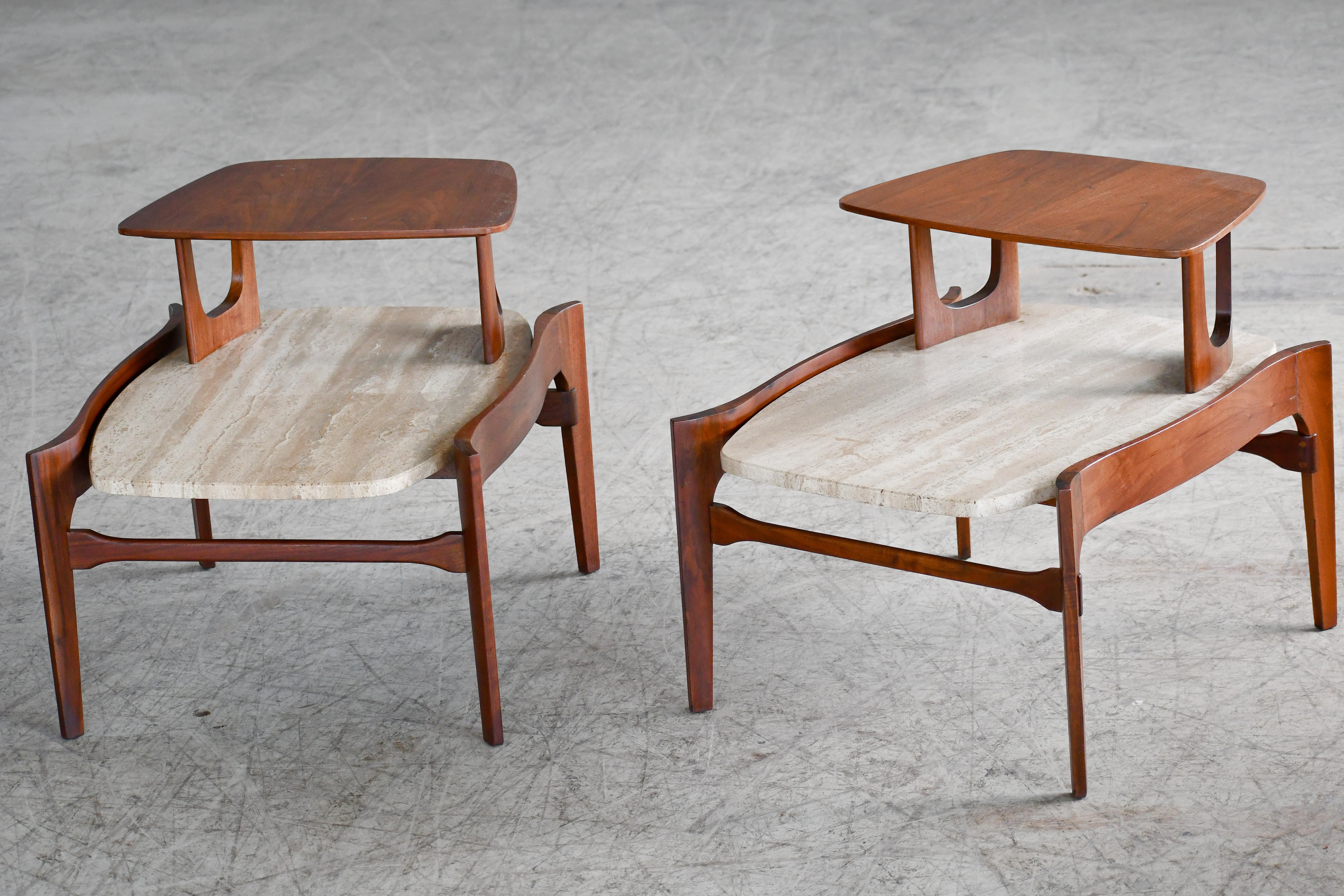 Fabulous two-tier boat tail shaped side or end tables designed by M. Singer and Sons produced in the 1950s. Very sculptural walnut frames with 