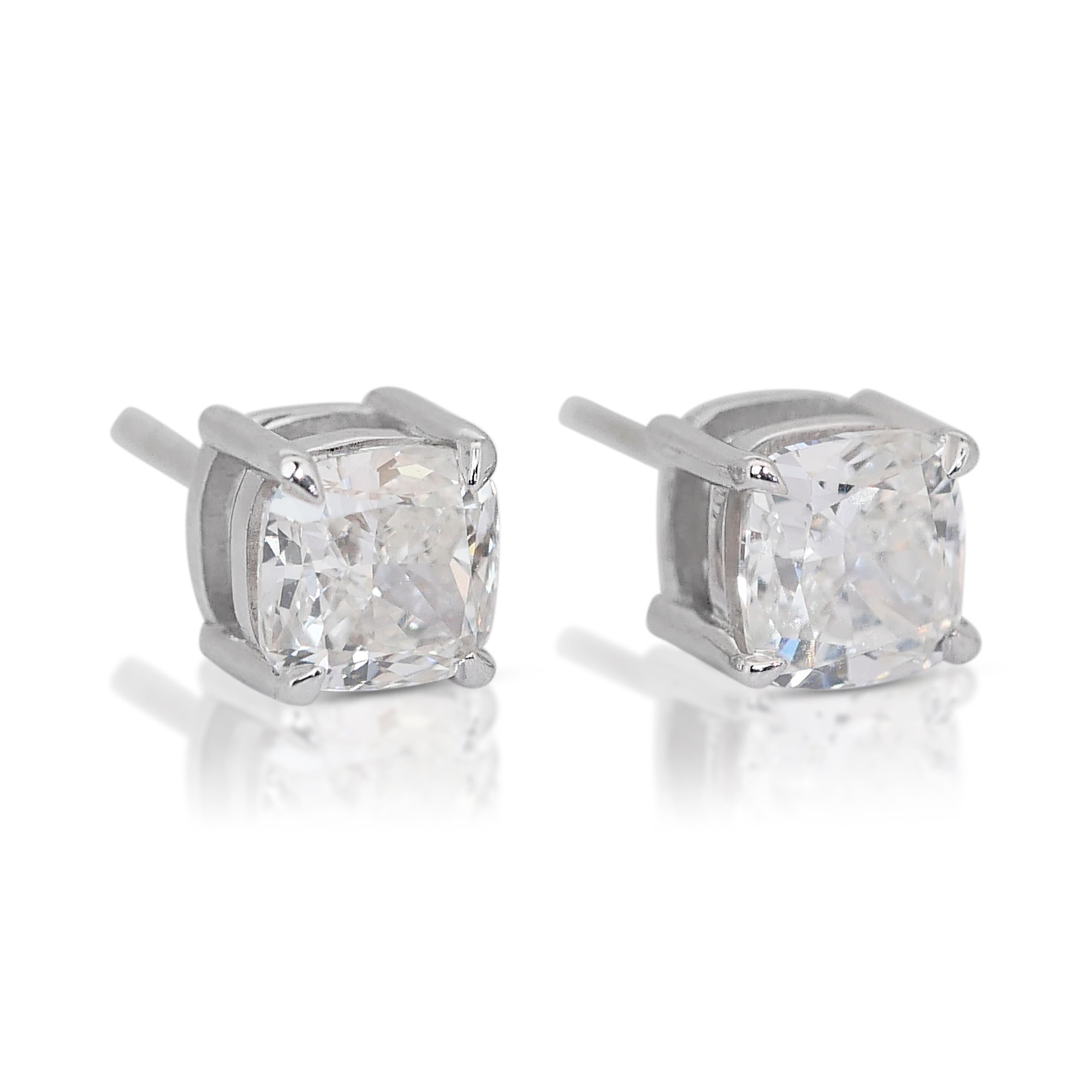 Elegant 2.00ct Diamonds Stud Earrings in 18k White Gold - GIA Certified

Enhance your elegance with these exquisite diamond stud earrings, featuring two stunning cushion-cut diamonds totaling 2.00-carat. These diamond stud earrings are the perfect