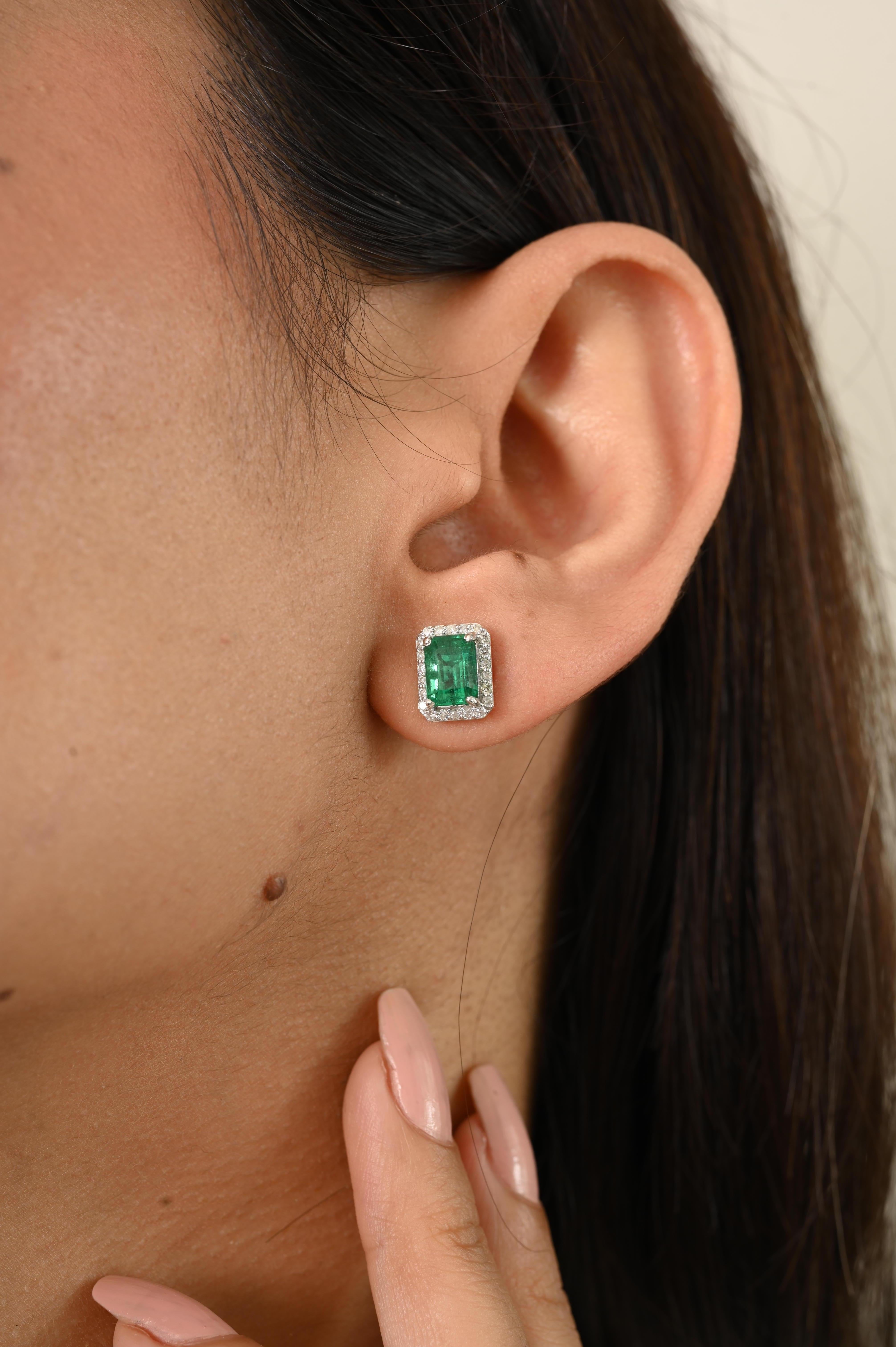 Women's Elegant 2.09Ct Emerald-Cut Emerald and Diamond Halo Stud Earrings 14k White Gold For Sale