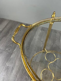 Elegant 20th Century Brass and Glass Rolling Table with Gallery