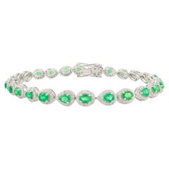 Eleganza: smeraldo e diamante da 3,11 CTW, bracciale da tennis di design in oro bianco 14 carati