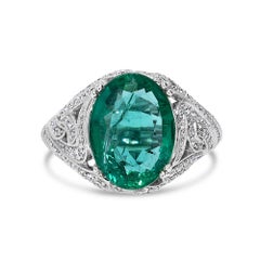 Elegante anello con smeraldo ovale verde certificato da 4,43 carati e diamanti in oro bianco 14k