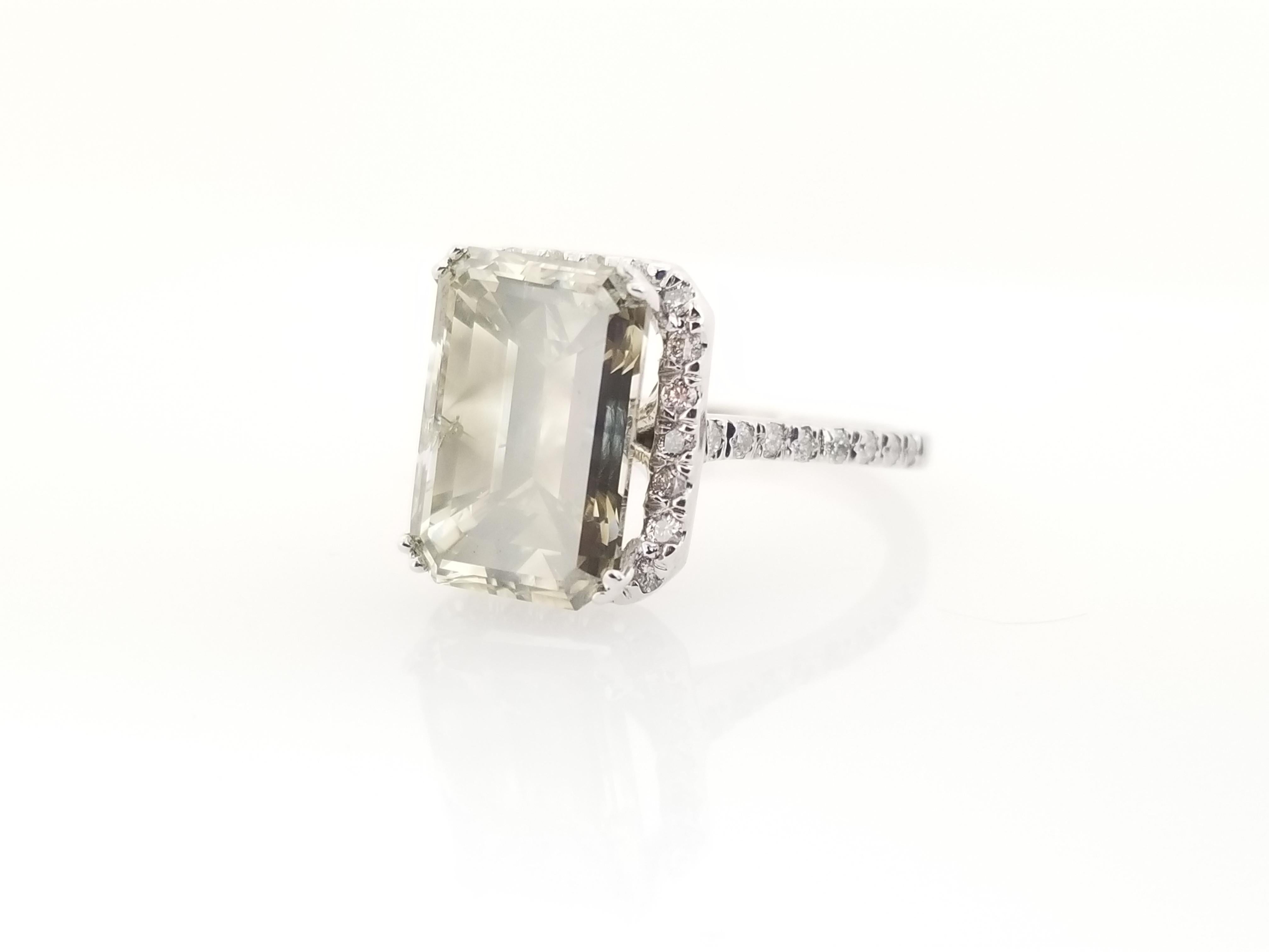 All Natural Fancy Color Gray Emerald Cut Diamond Ring Weighing 5.51 carats by IGI .Set on White Gold 14 Karat,  Elegance for every occasion.

IGI # GT12753503
Measurements: 12.12X8.23X6.29mm
Center Stone Weight: 5.51 cttw
Side Diamonds: 0.45