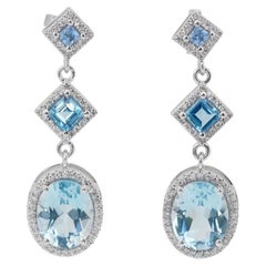 Elegant 7.02 Carat Oval Mixed Cut Topaz Earrings in 14K White Gold