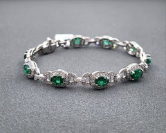 Elegant 7.06 Carat Natural Emerald and Diamond Platinum Tennis Bracelet