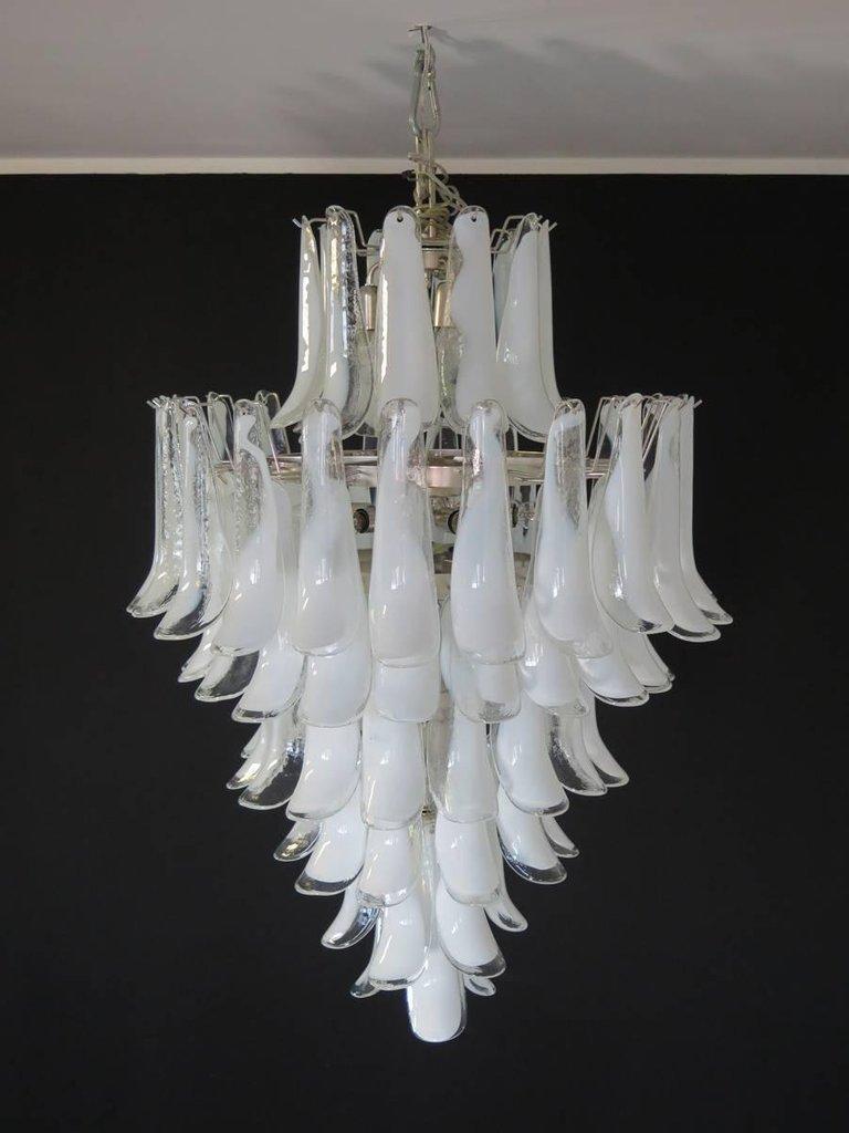 Hand blown glass chandelier, composed of 84 curved glass pieces, which are arranged on seven tiers, suspended from a nickel metal structure. Available in different colors!
Dimensions: 47.25 inches (120 cm) height without chain; 31.50 inches (80 cm)