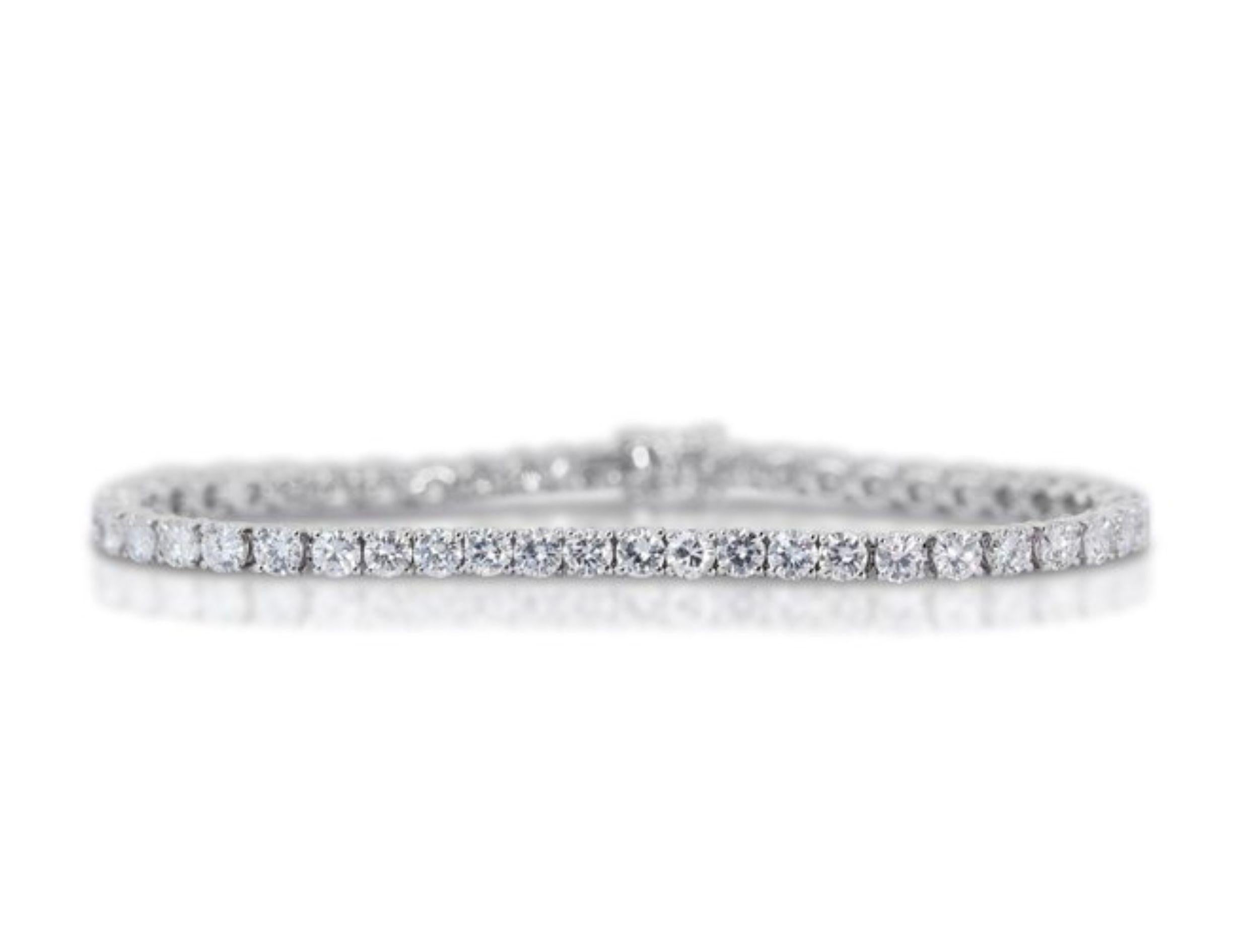 Ignite Eternal Radiance with This 8.88 Carat Diamond Tennis Bracelet in 14K White Gold (IGI Certified)
This bracelet is a breathtaking symphony of sparkle, featuring a mesmerizing 8.88 carats of round brilliant diamonds, certified by the renowned