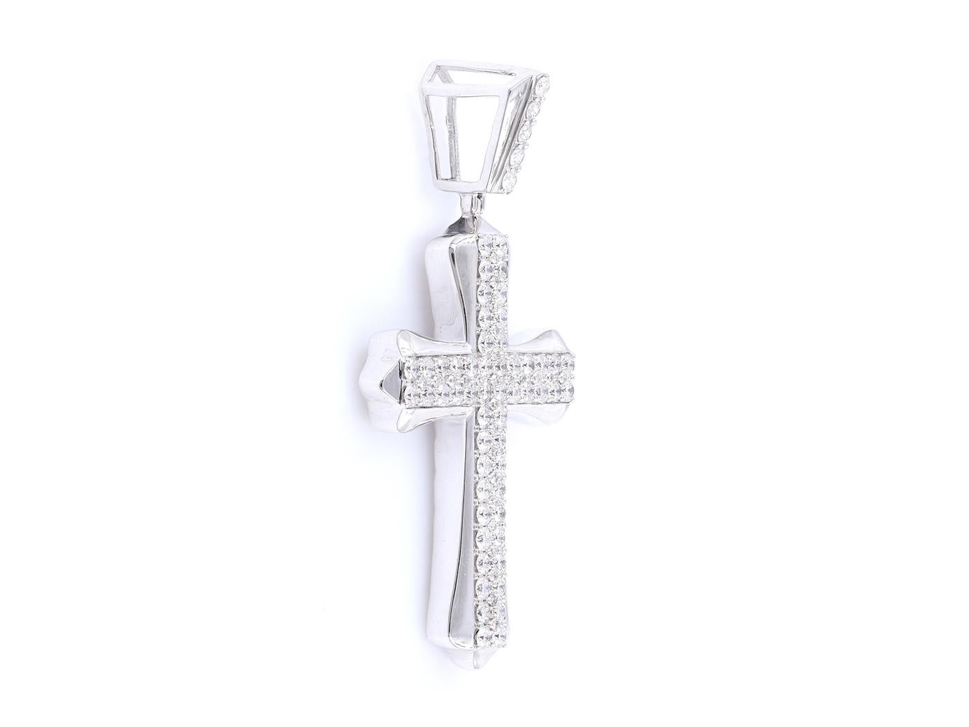 The bold cross design, encrusted with 1.99 total carats of natural diamonds, exudes elegance and sophistication. Make a timeless statement with this stunning diamond pendant. (Chain not included)

Material: 8KT White Gold

Gold Weight: 13.76