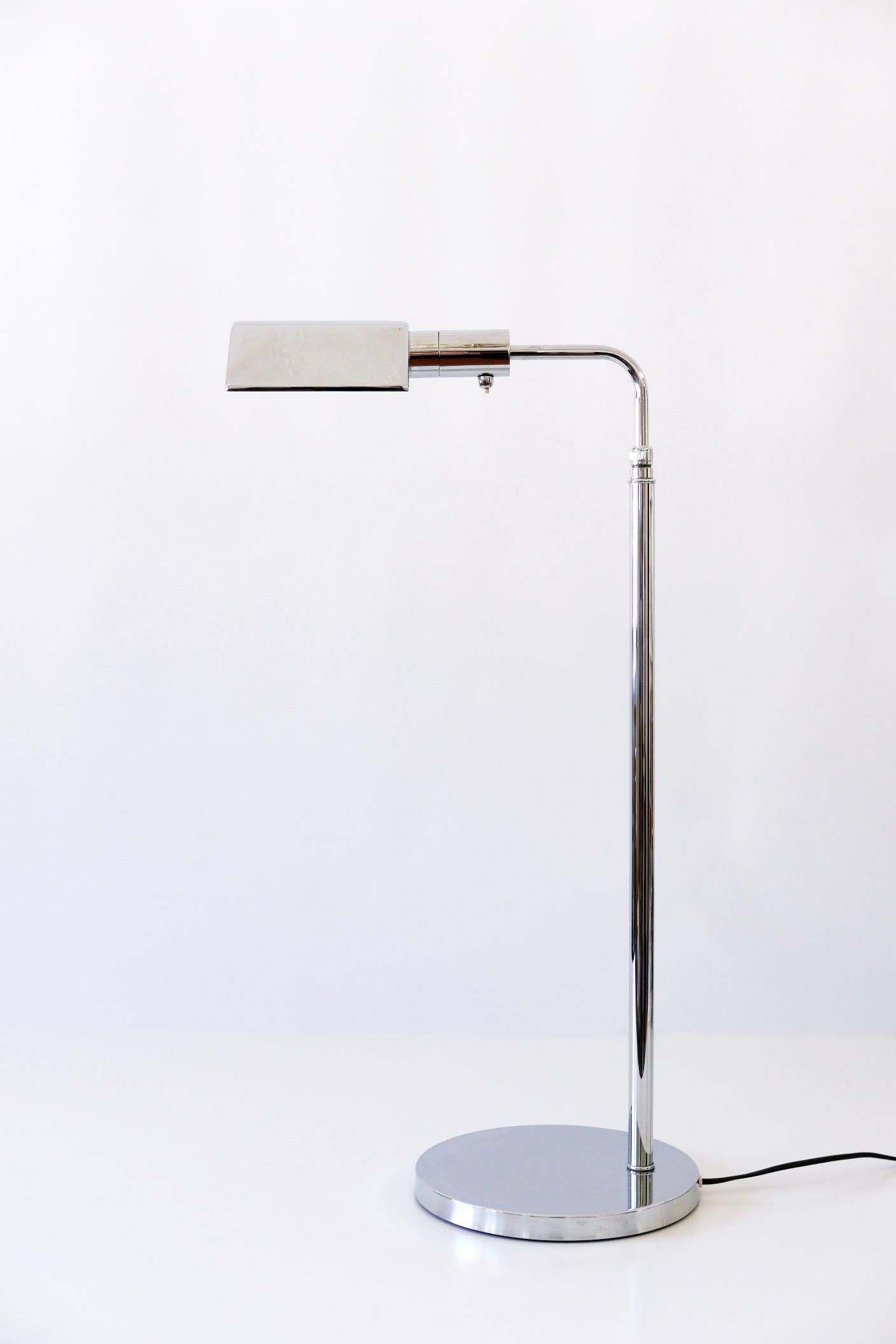 Elegant Mid-Century Modern floor lamp or reading light with adjustable height and pivoting arm and shade. Designed and manufactured in 1970s, Germany.

Executed in chrome-plated brass, the lamp needs 1 x E27 Edison screw fit bulb, is wired, and in