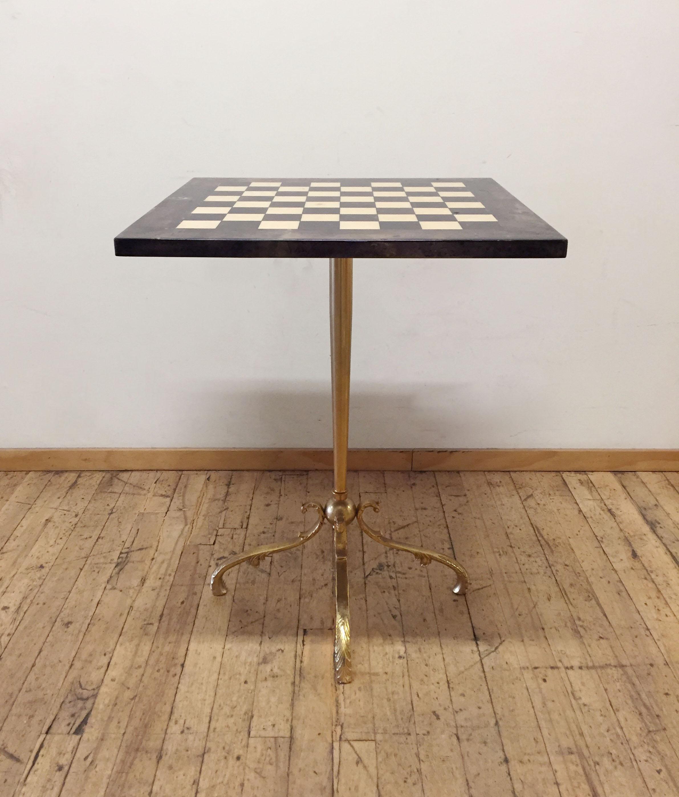 Aldo Tura goatskin chess table. Made in Milano Italy. Beautiful gilt base with conical form.