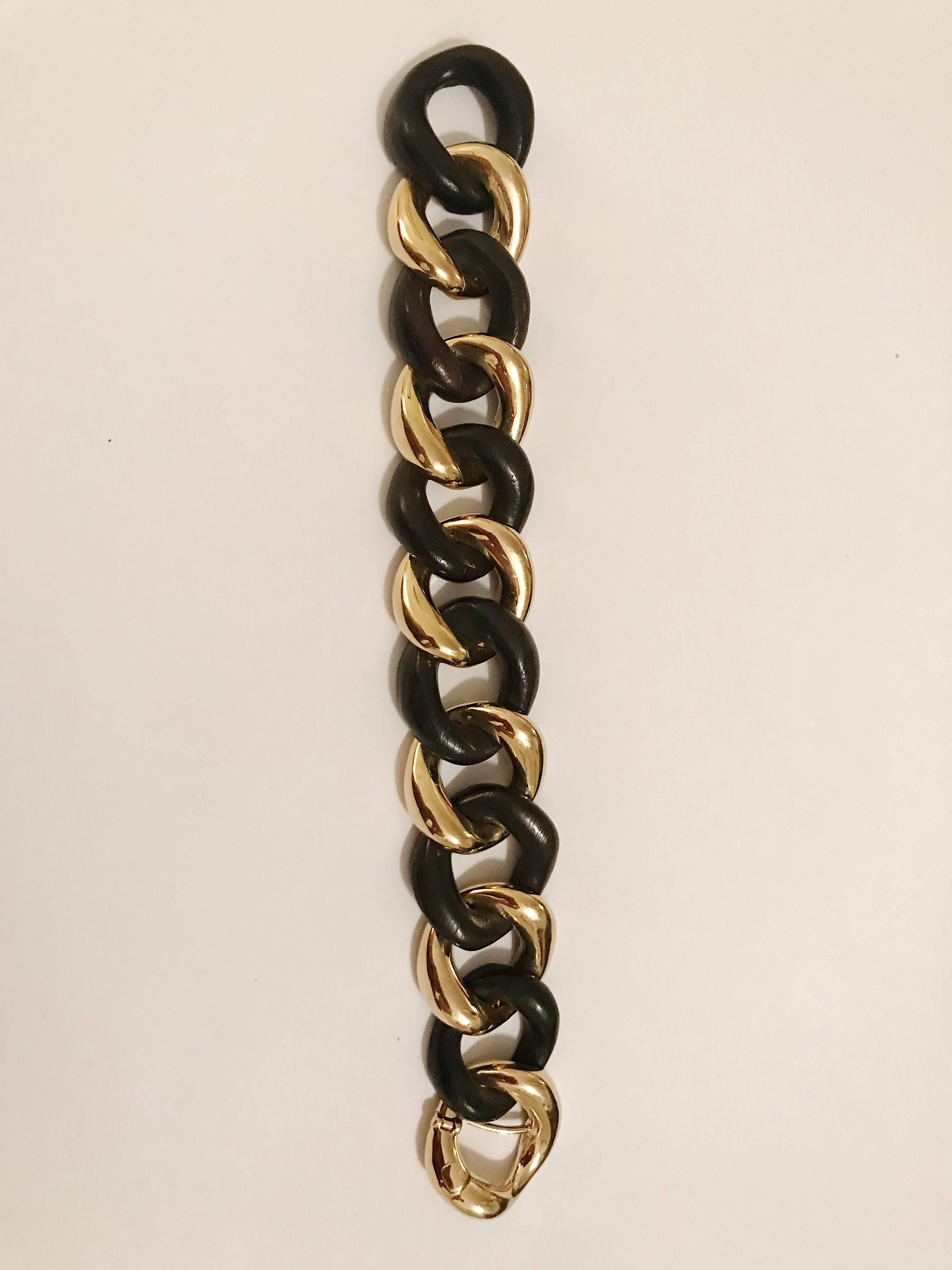 Elegant 18kt Yellow Gold and Cocobolo Wood curved link bracelet with self-link closure. The fabulous bracelet measure 7 1/2 inches but can be made to any measurement. The gold and Multi Wood links measure approximately 3/4