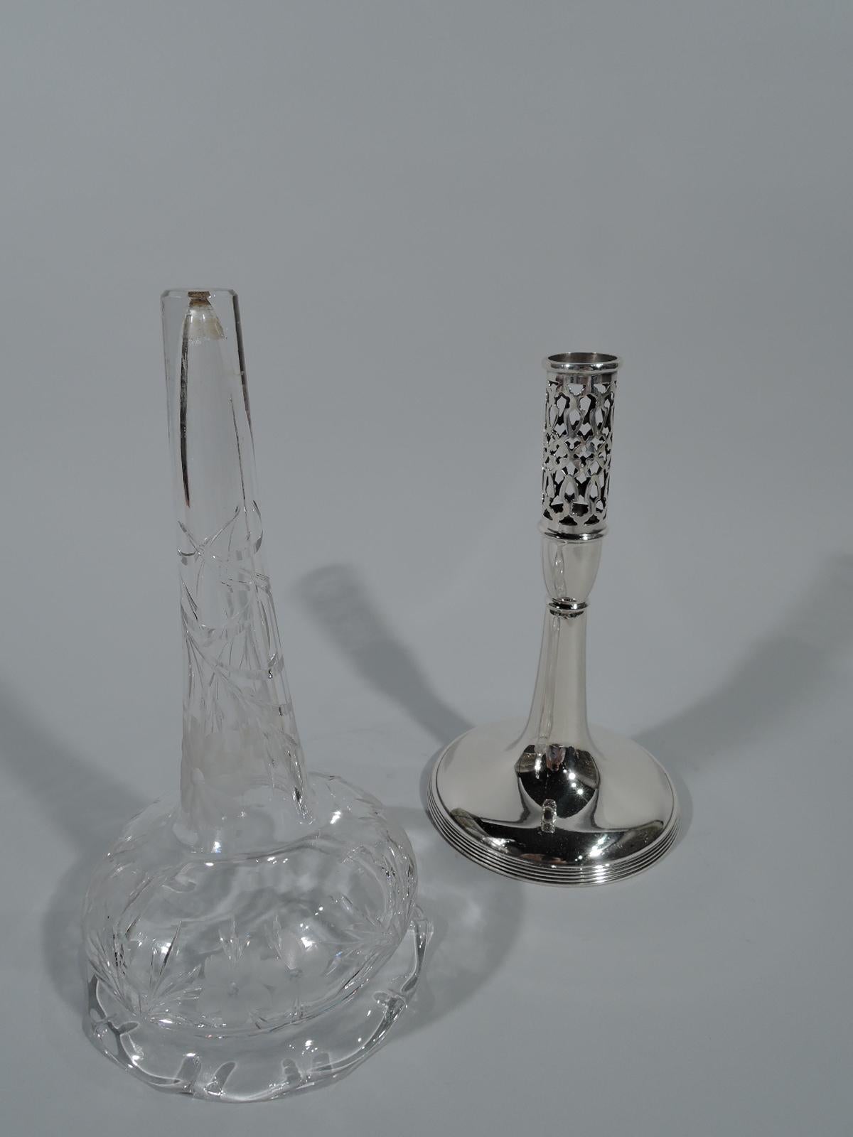 Elegant Edwardian sterling silver and crystal vase. Made by Durgin (later part of Gorham) in Concord, NH. Sterling silver base comprising pierced cylinder on urn mount terminating in upward tapering shaft on raised foot with reeded rim. Crystal