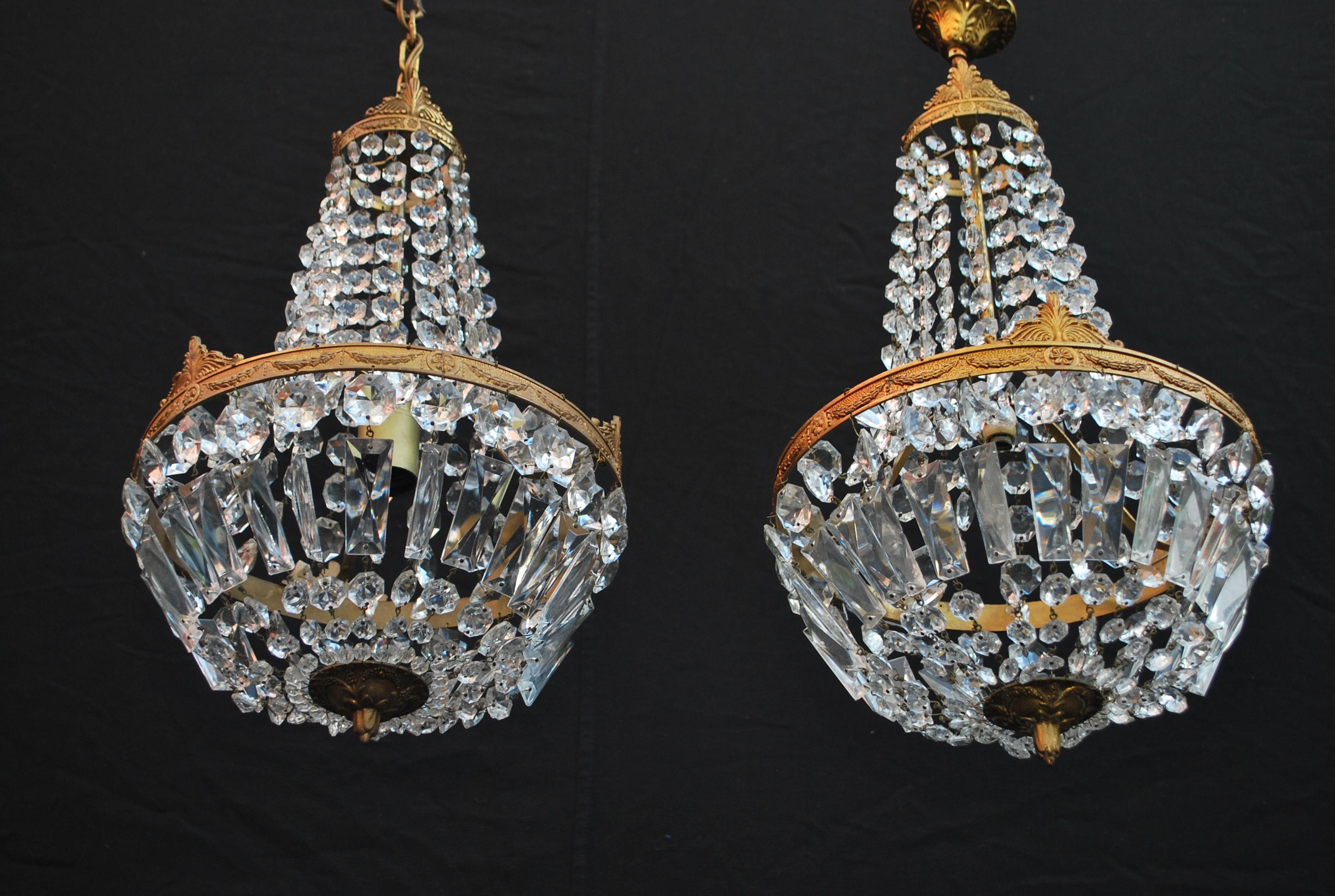 A beautiful pair of French 1940's crystal pendant, please be aware of one, the brass is a little lighter compere to the other, ( see picture ) if not, it is rare to have a pair.