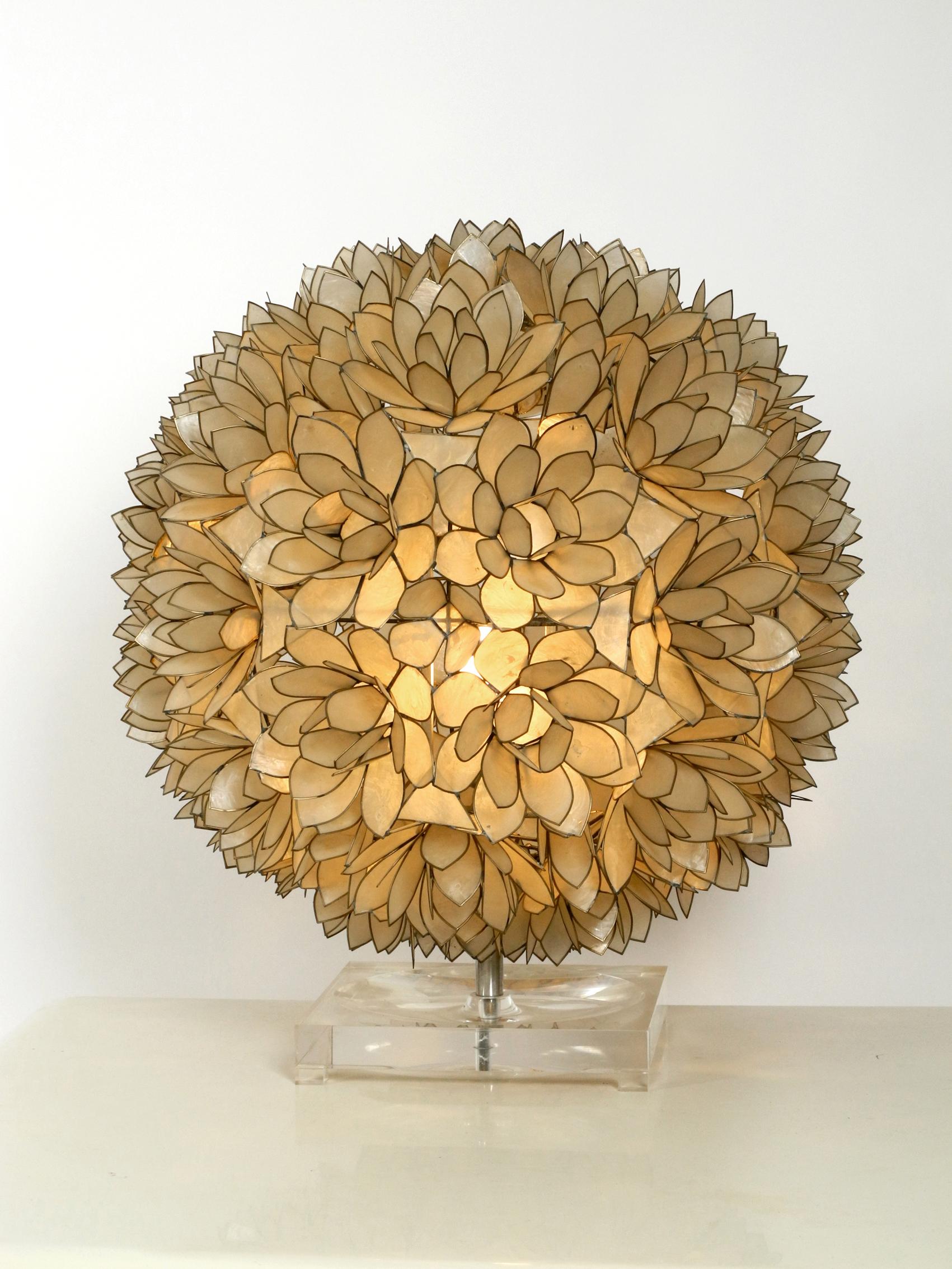 Very elegant huge beautiful flower table lamp in spherical shape consisting of blossoms made of mother of pearl. Manufacturer is Rausch Beleuchtung, Made in Germany. Great rare design of the 1970s. Very high quality workmanship. Metal frame is solid
