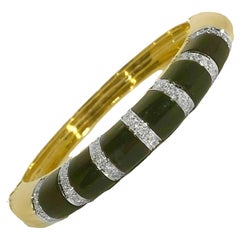 Elegant and Iconic 1970's Bombe Black Onyx and Diamond 18K Gold Bangle Bracelet