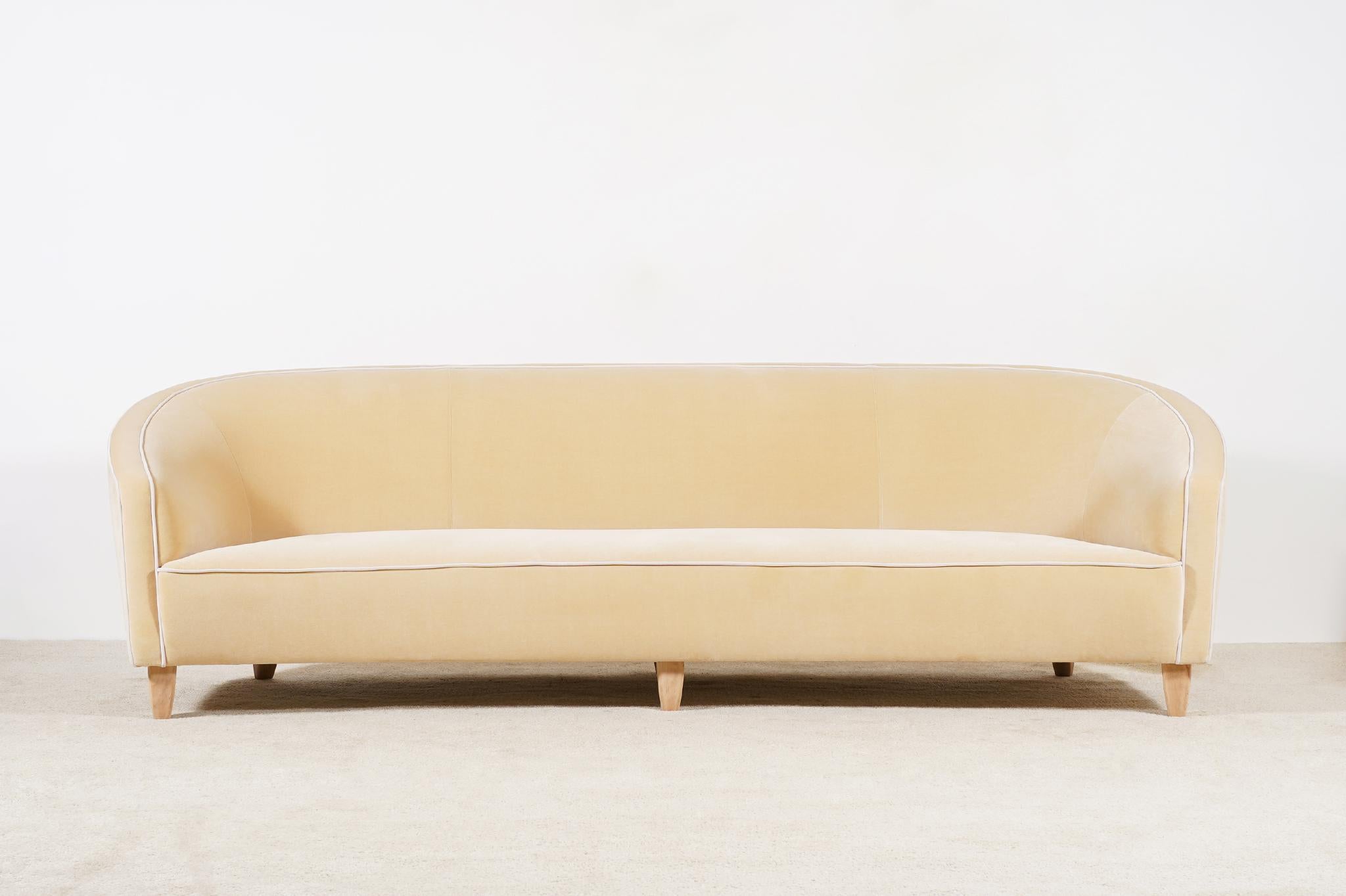 Elegant and wide Italian three-seat curved sofa. Circa 1950/60.
Soft and comfortable seat. Light beech waxed feet.
Perfect condition.

Original pieces from the 1950s newly re-upholstered in the traditional way by the best French craftsmen, we used a