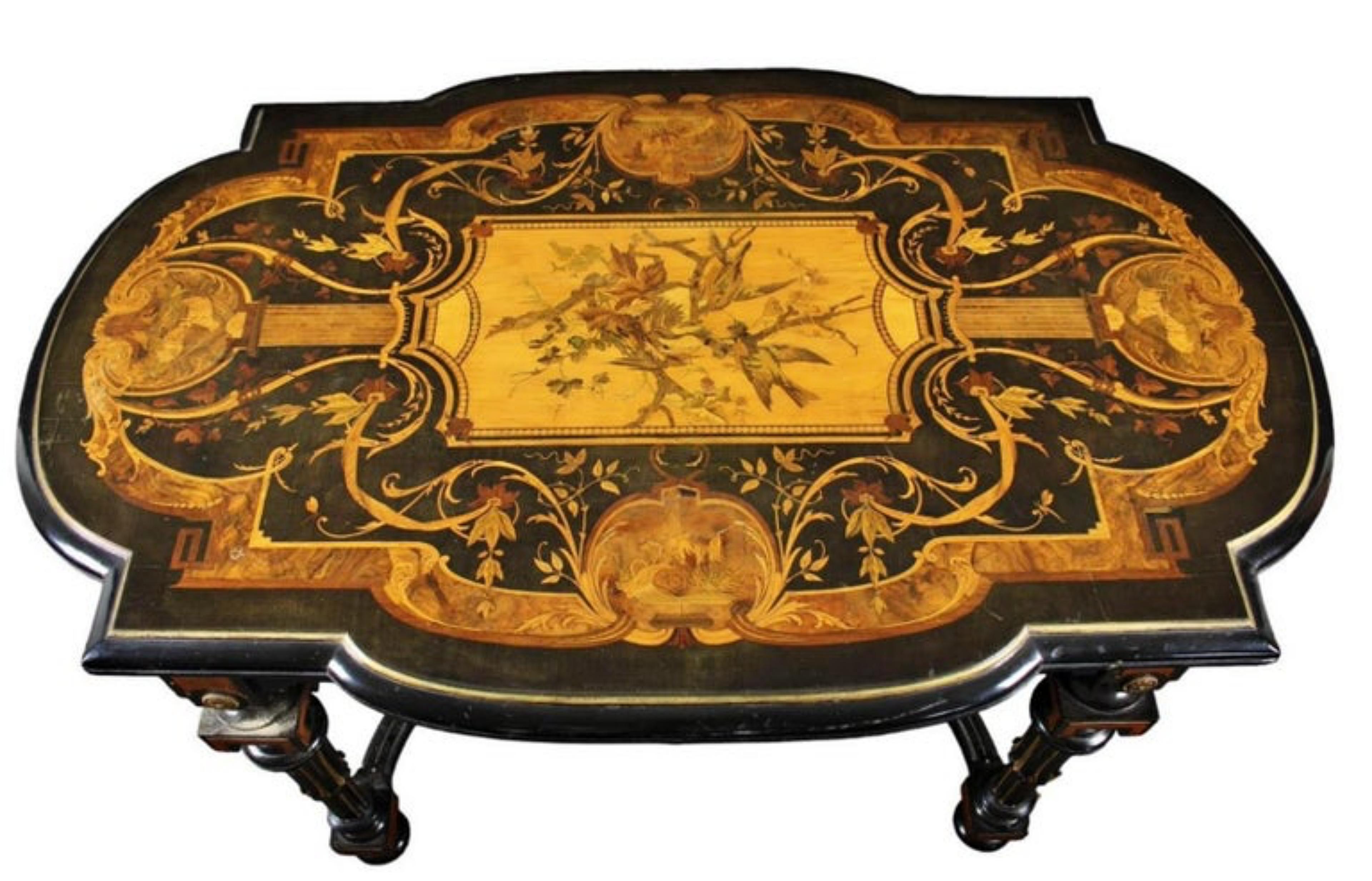 ELEGANT and PRECIOUS NAPOLEON III CENTER TABLE 19th Century

in ebonized wood richly inlaid in various wood and brass essences with floral motifs inside a reserve of birds on the branches, enriched by bronze applications

France 19th century

h 72 x