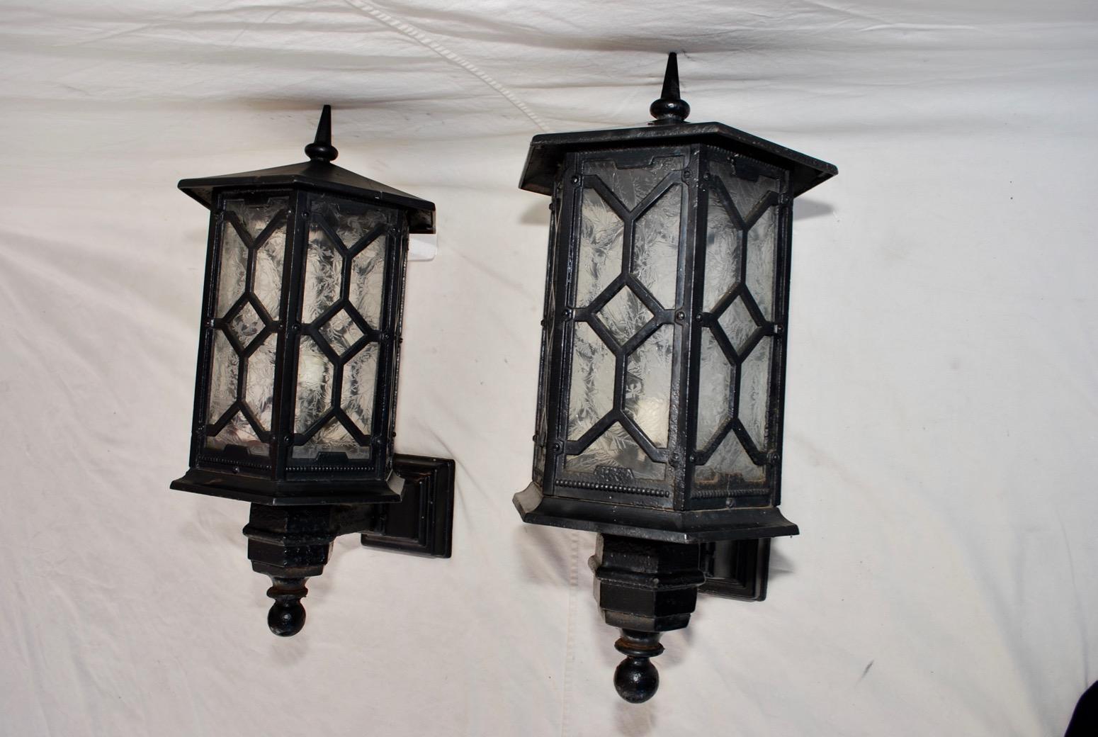 American Elegant and Rare Large Pair of 1920s Cast Iron Outdoor Sconces