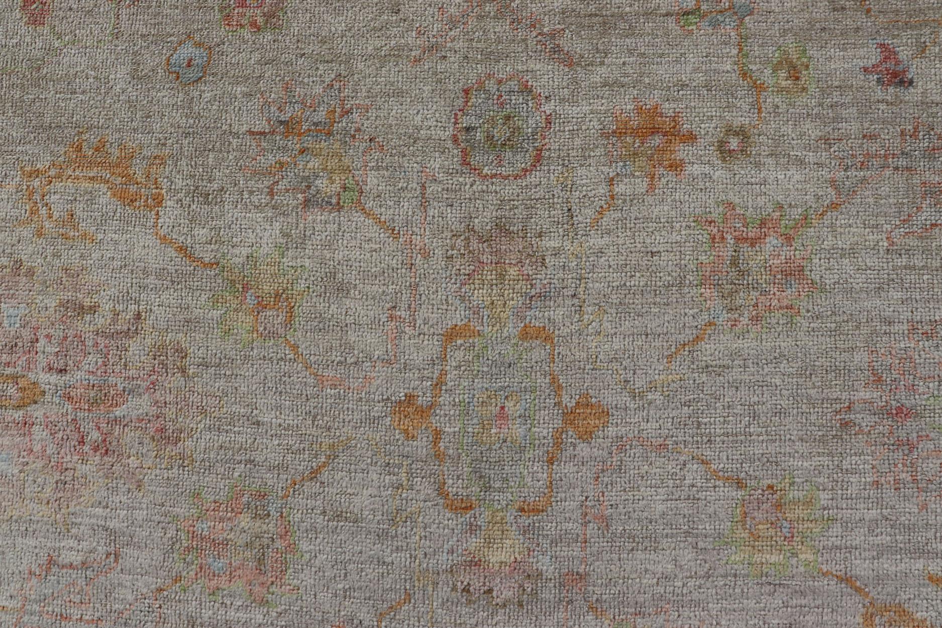 Measures: 9'3 x 12'3 
The Elegant Angora Turkish Oushak Rug brings a touch of timeless beauty and sophistication to any interior space. Featuring a delicate and intricate design, this rug is a testament to the exquisite craftsmanship of traditional
