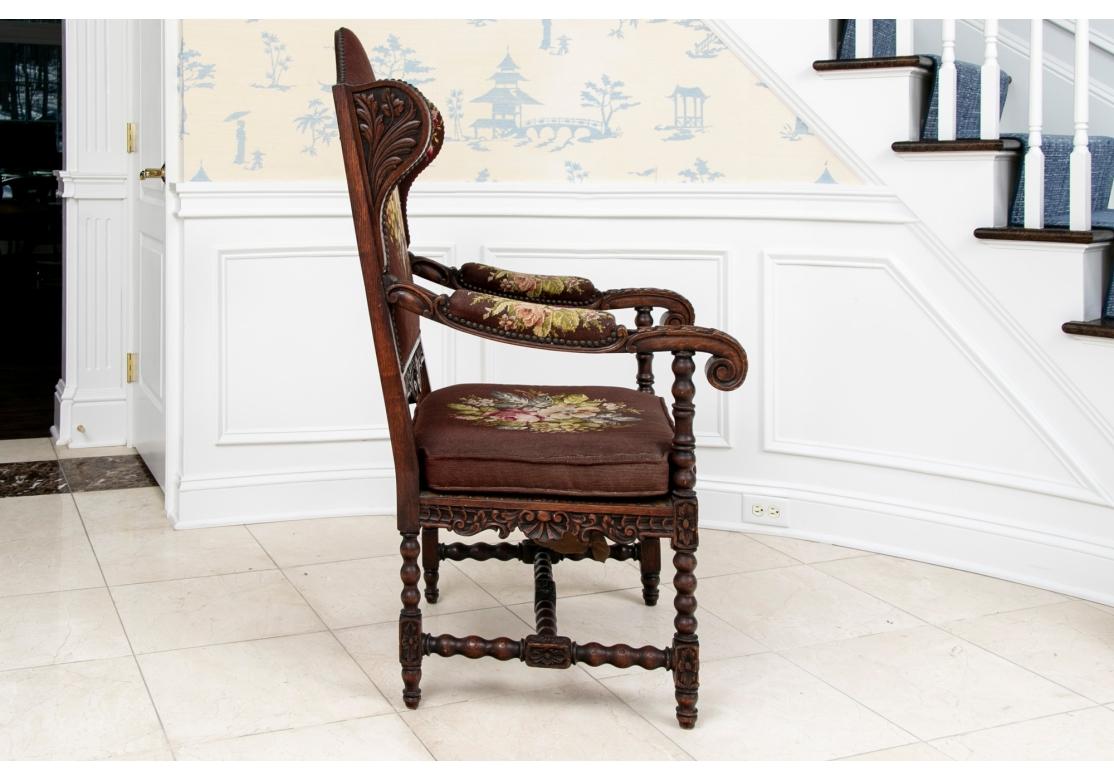 Elegant Antique Carved Hall Wing Chair In Needlepoint Upholstery With Foot Stool For Sale 4