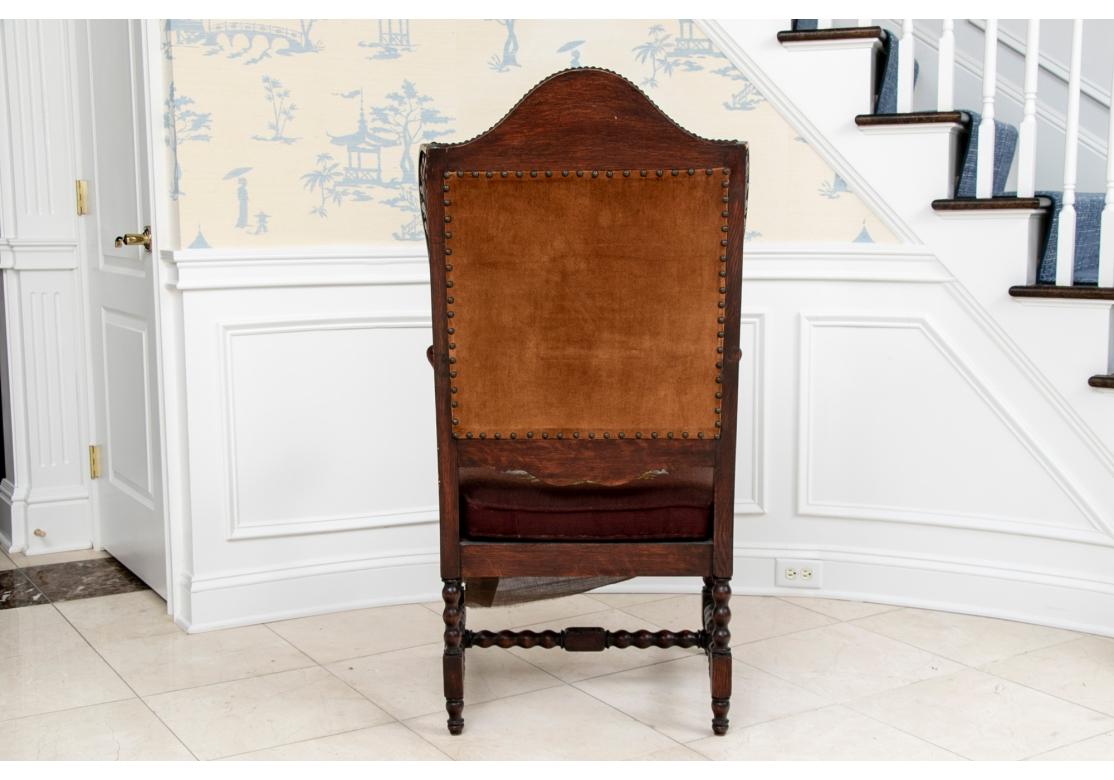 Elegant Antique Carved Hall Wing Chair In Needlepoint Upholstery With Foot Stool For Sale 10