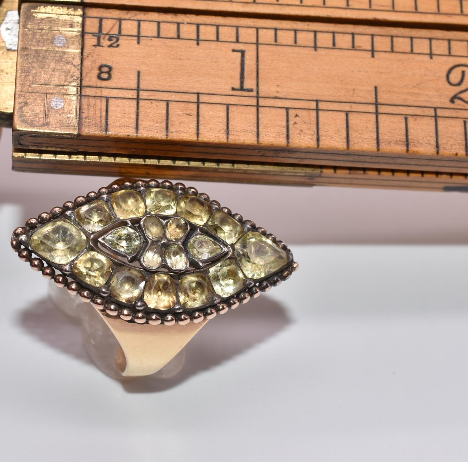 Antique marquise shaped 18K gold and chrysoberyl ring is an excellent example of Portuguese jewelry of the late 18th century. The Portuguese mined these gemstones from their colony in Brazil and created jewelry that was typically pave-set as seen