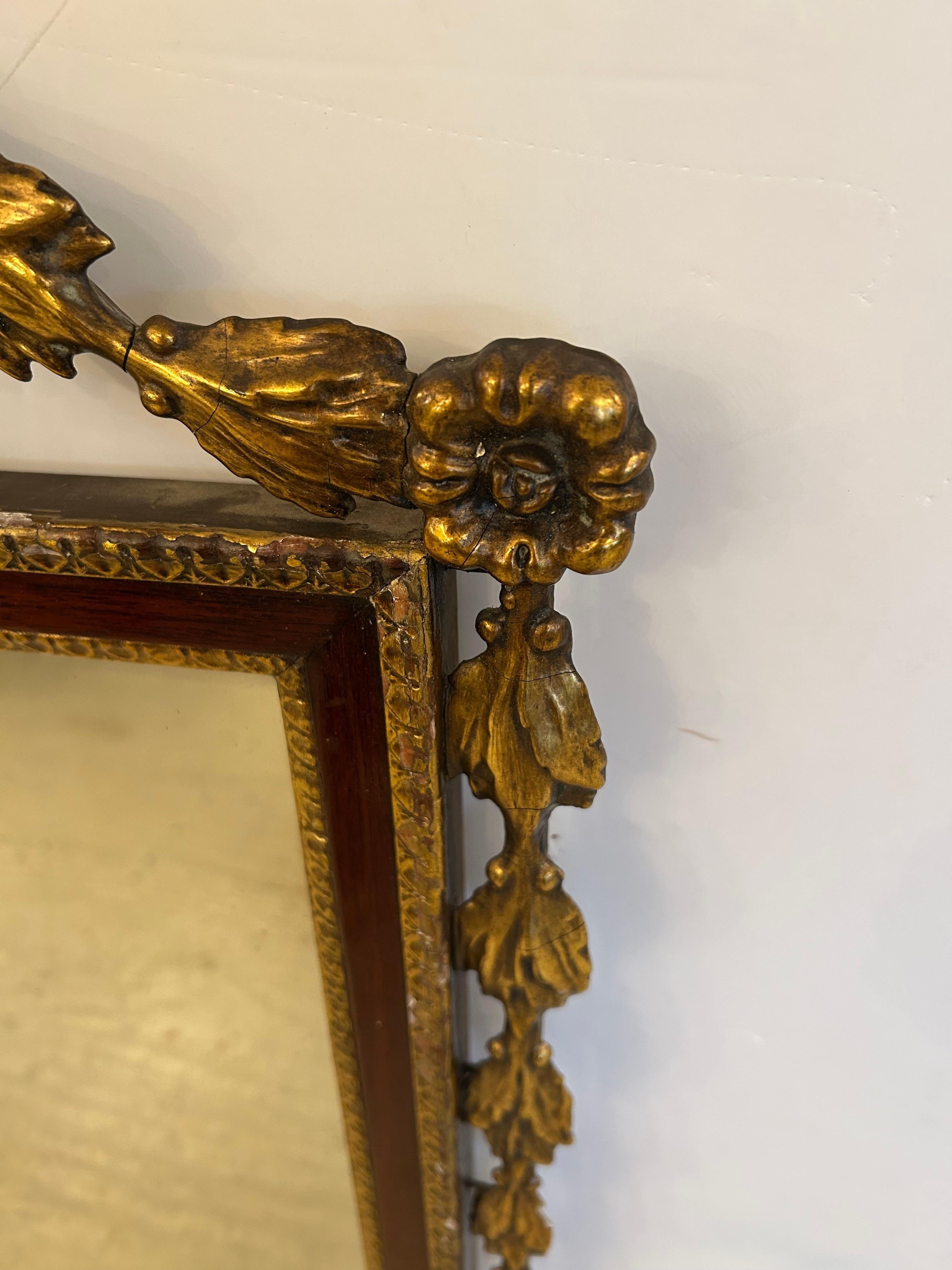 Wood Elegant Antique Regency Mirror with Gilding and Flower Basket For Sale