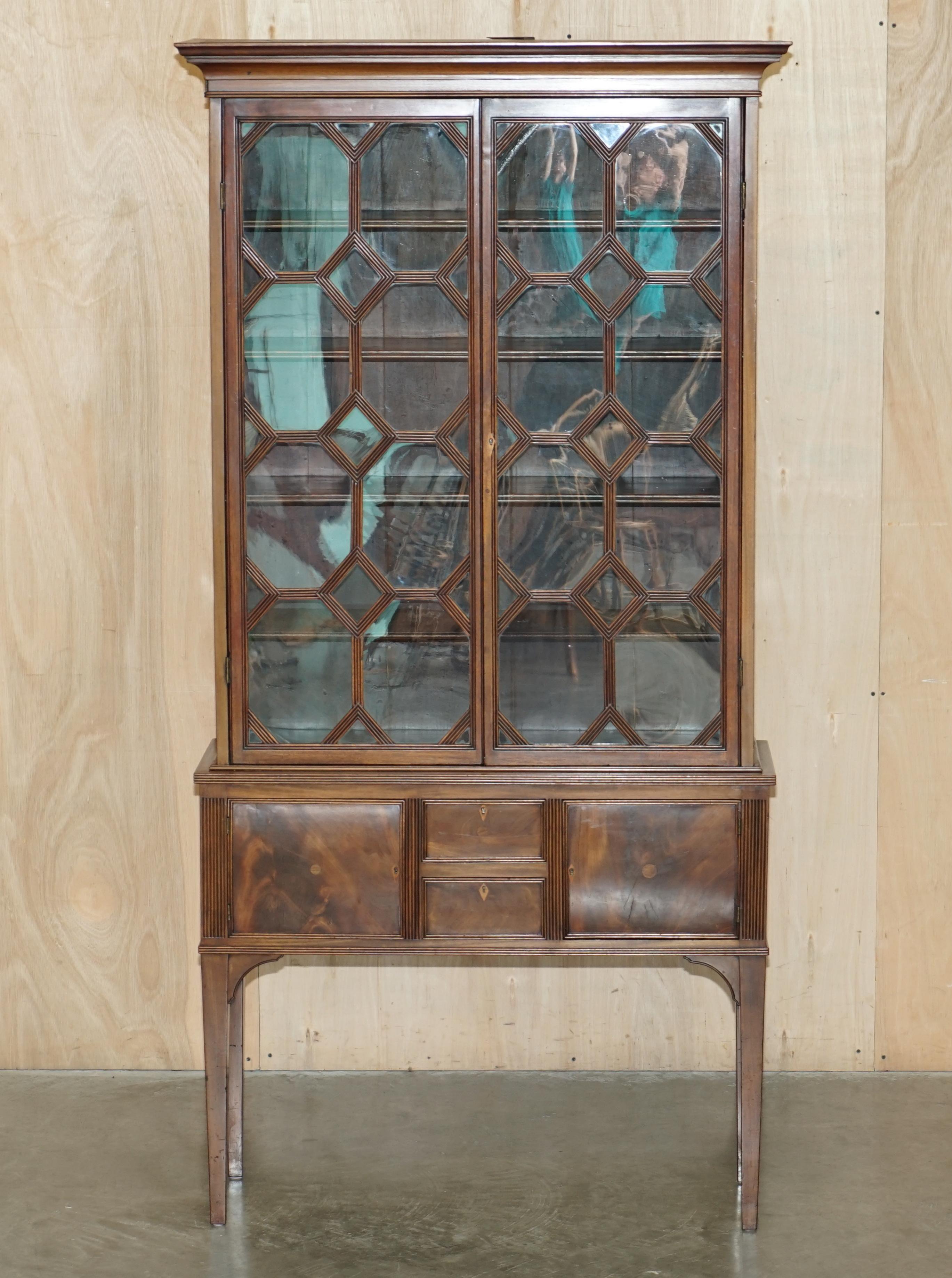 Royal House Antiques

Royal House Antiques is delighted to offer for sale this very Elegant, hand made in England Astral glazed Library bookcase with long legs and a flamed mahogany cupboard base

Please note the delivery fee listed is just a guide,