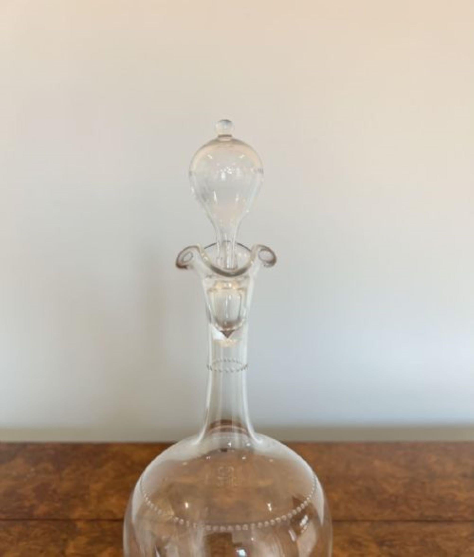 Elegant antique Victorian quality decanter having an elegant antique Victorian decanter with a lovely wavy shaped top, a rounded body standing on a circular base with the original glass stopper. 