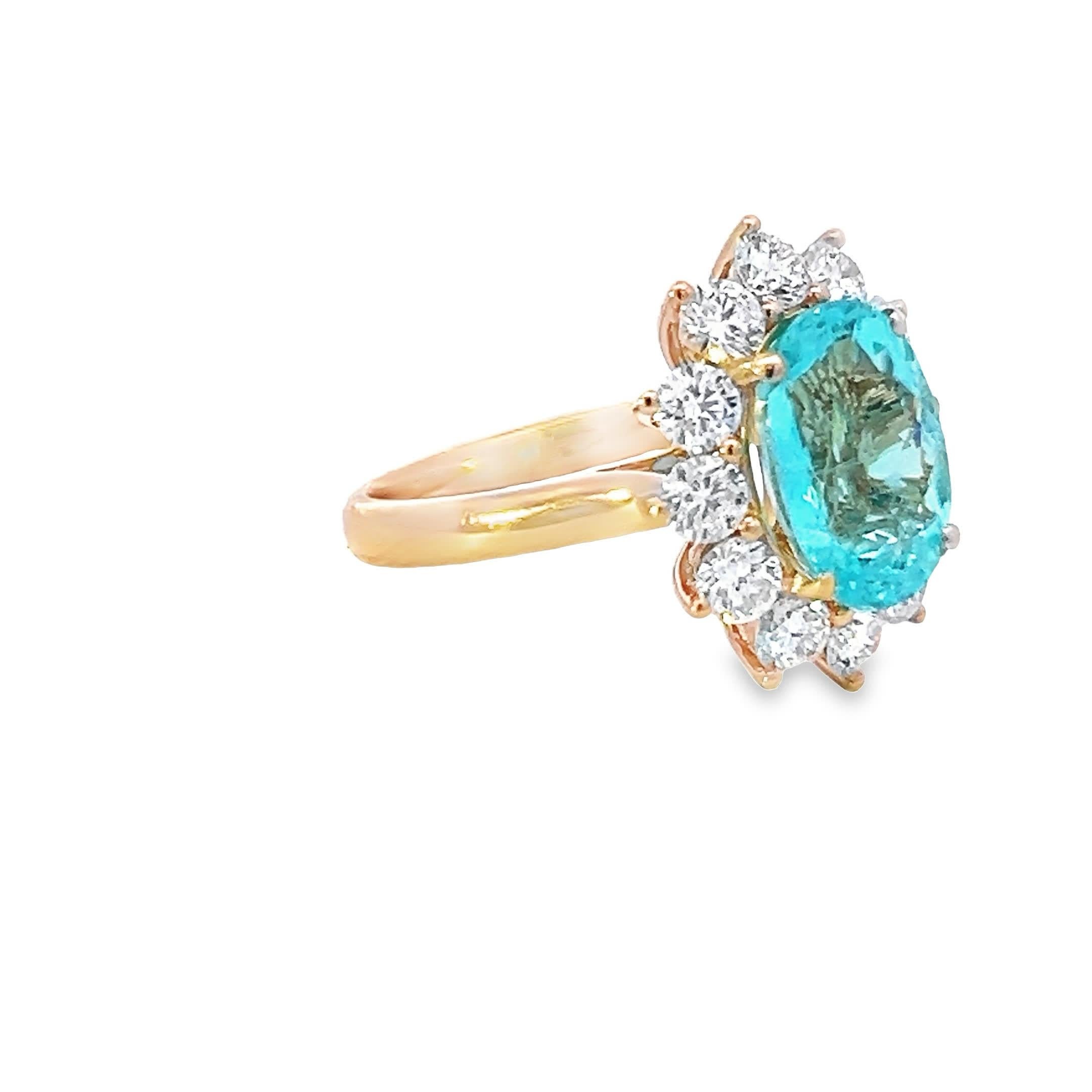 A stunning piece that embodies sophistication, this exquisite aquamarine ring is a symphony of sparkle and style. The central gemstone's cool blue hue evokes the serenity of ocean waters, embraced by a halo of scintillating diamonds set on a band of
