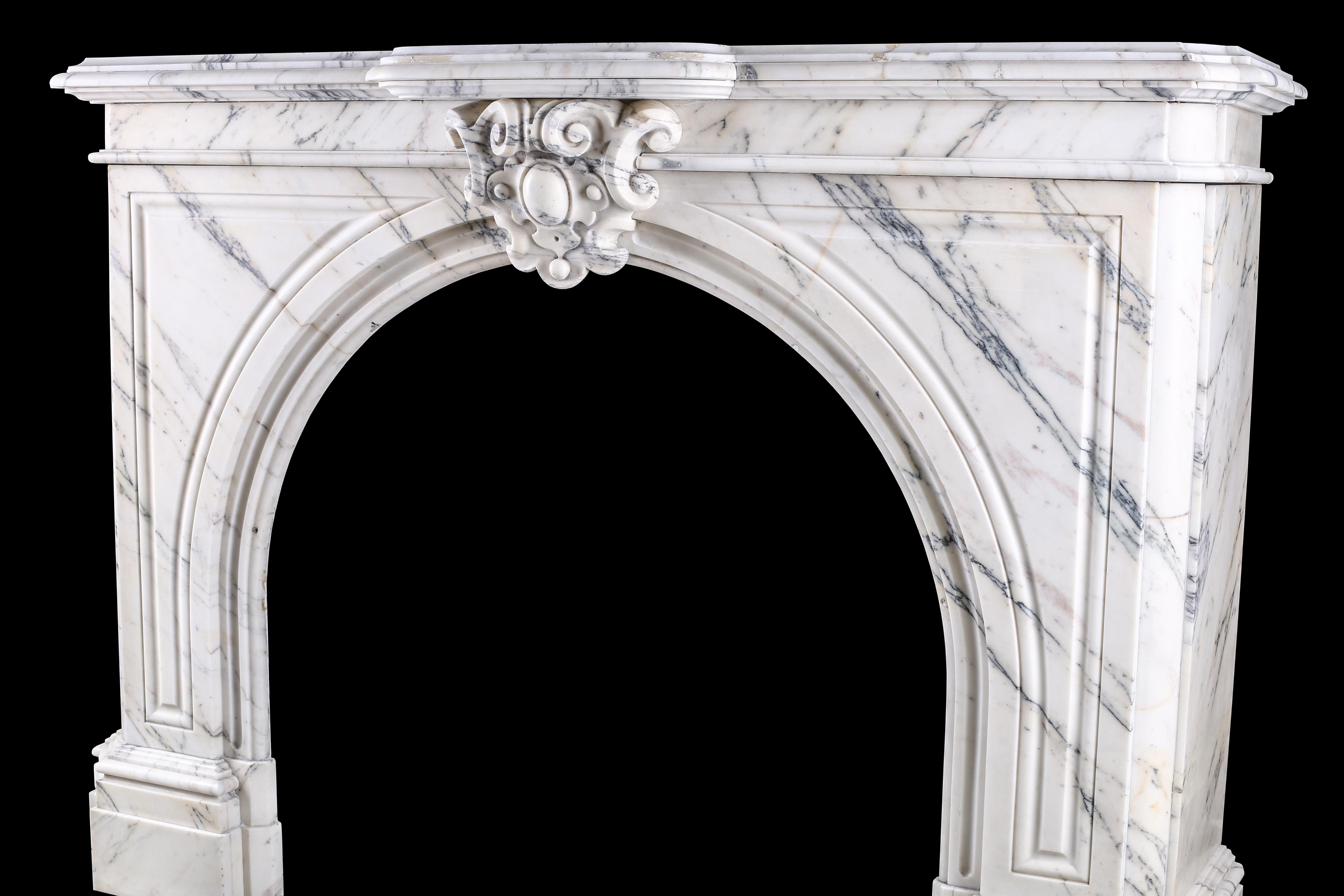 An elegant arched Pavonazza marble antique chimneypiece, Belgian mid-19th century.

Measures: External width 62? – 157.5 cm, external height 44 1/4” – 112.5 cm, depth 16 3/4? – 42.5 cm
Internal width 37? – 94 cm, internal height 35? – 89