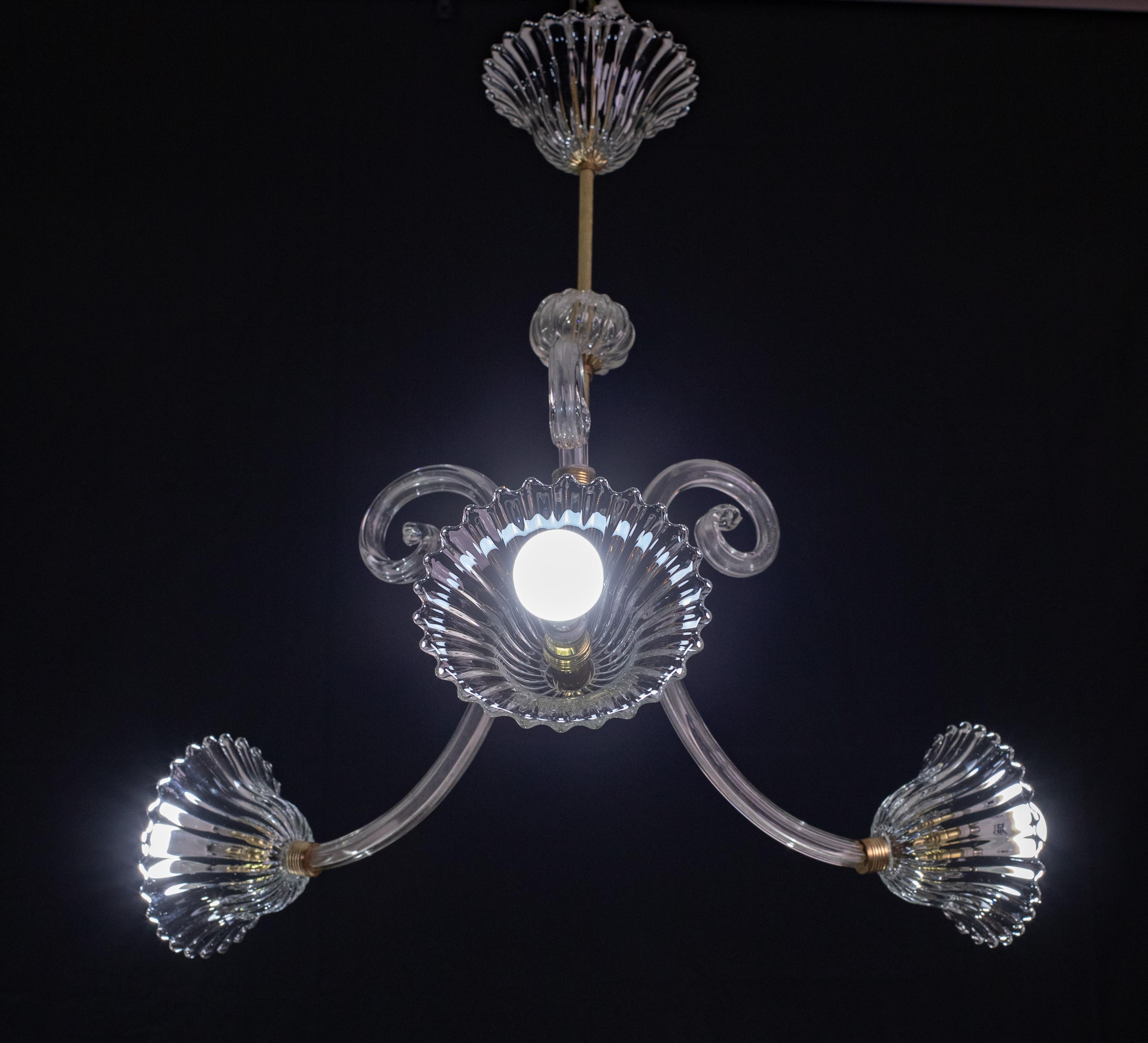 Exquisite three-armed, three-leafed model.

Period: circa 1940

Height 70 centimeters, diameter 55 centimeters; a longer central rod can be put in upon request, making the chandelier 110 centimeters.

Excellent period condition.