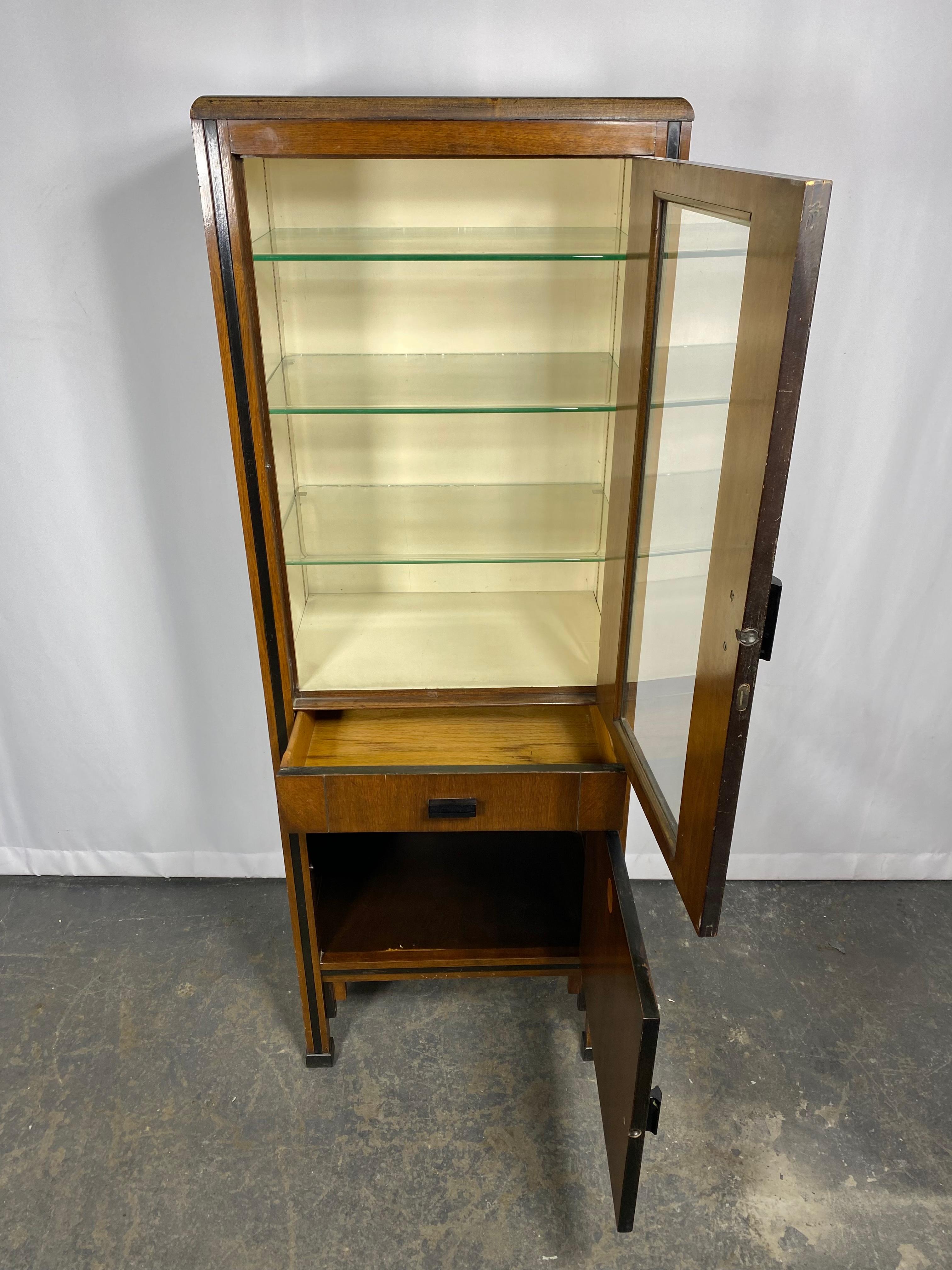 Elegant Art Deco Dental cabinet, walnut and glass, manufactured by ENOCHS In Good Condition For Sale In Buffalo, NY