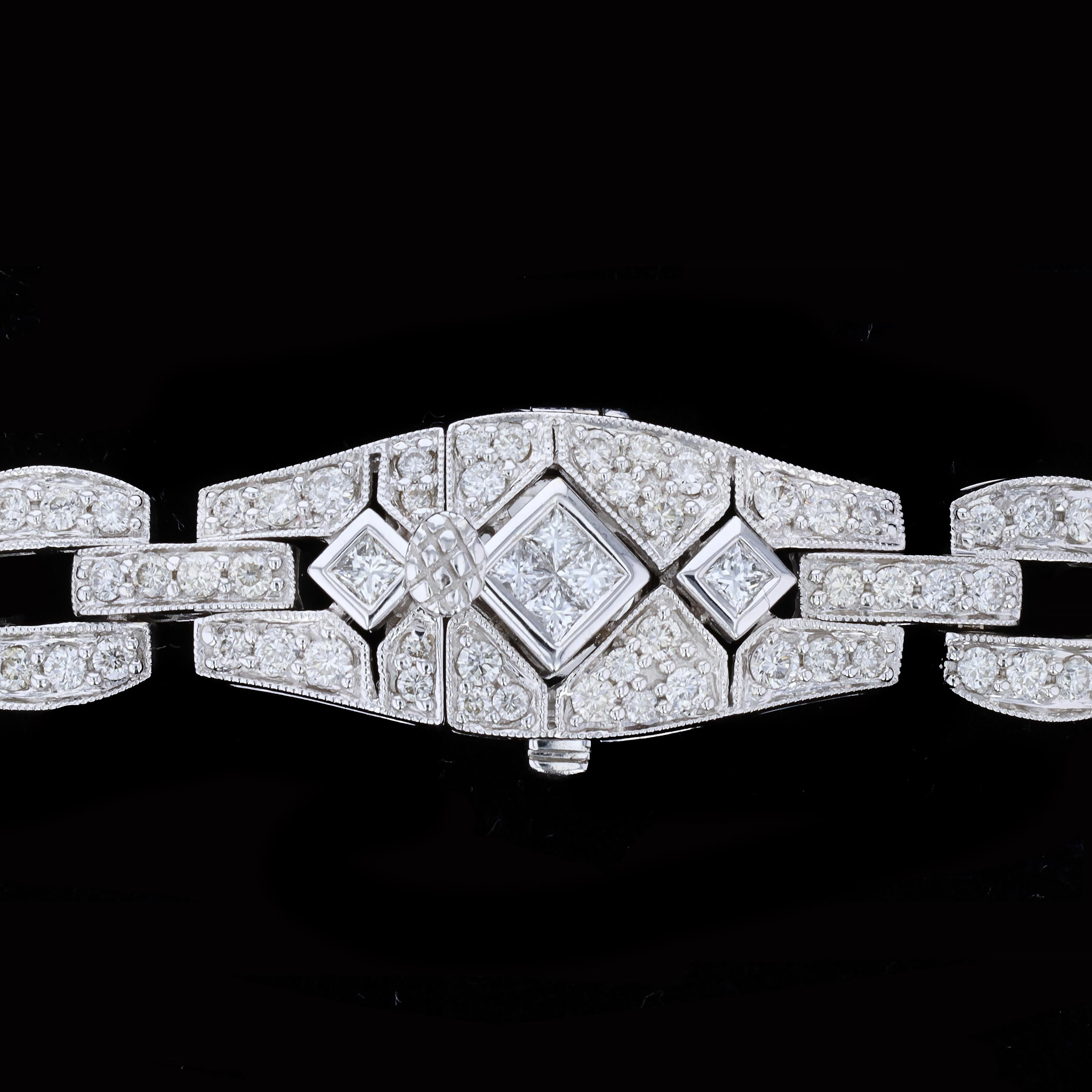 Vintage style dazzles in this intricately designed Art Deco diamond bracelet. This exquisite 18K white gold bracelet features 4.73ct. in princess and round cut diamonds set in square links and diamond shapes. The color of the diamonds is H with VS1