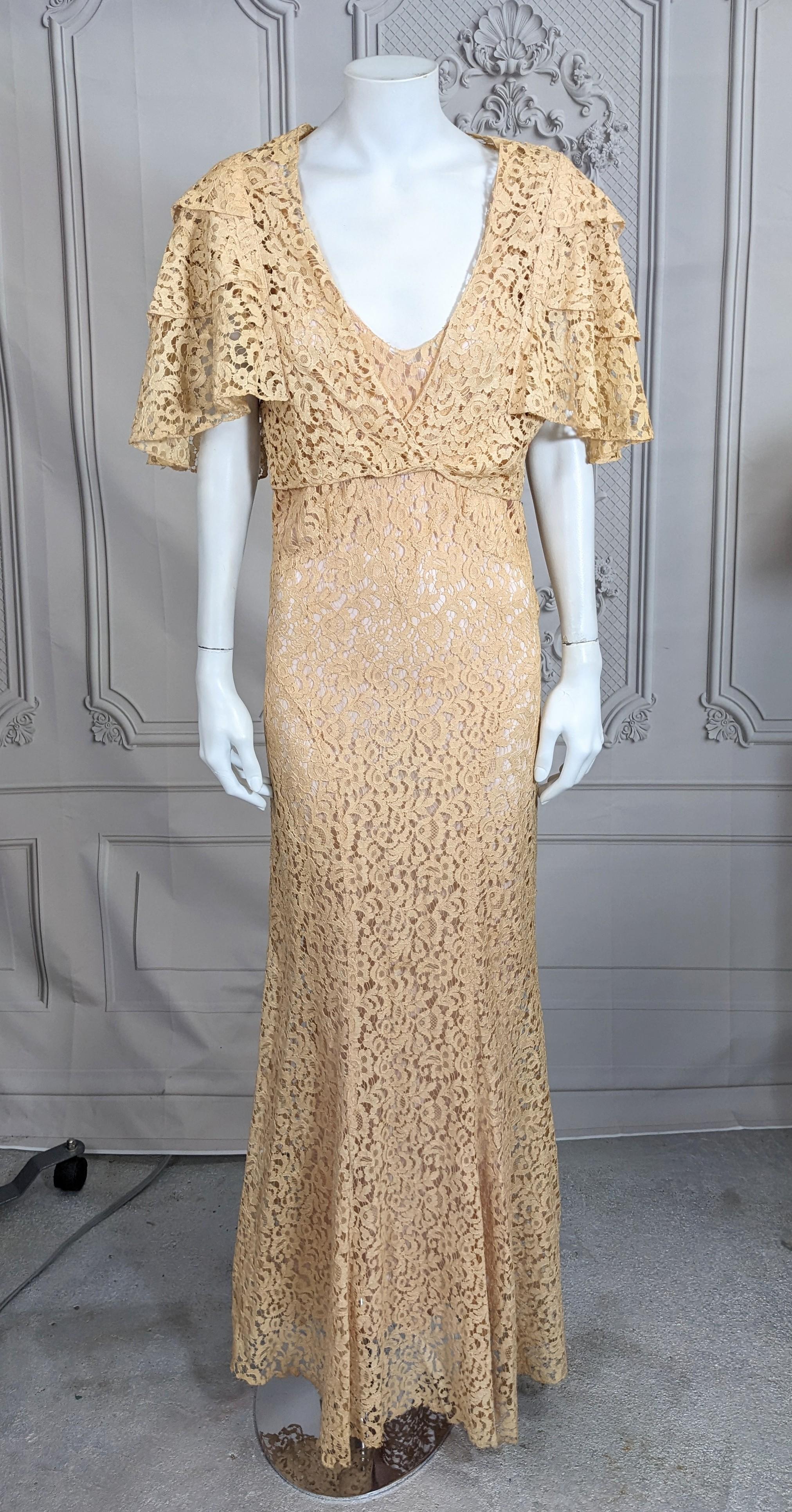 Lovely Art Deco Lace Evening Ensemble of cotton lace. Sleek gown with capelet bolero of 3 tier ruffled sleeves which snaps across the front. Typical Deco seaming on gown with deep V back neckline, fitted through torso which releases to fullness