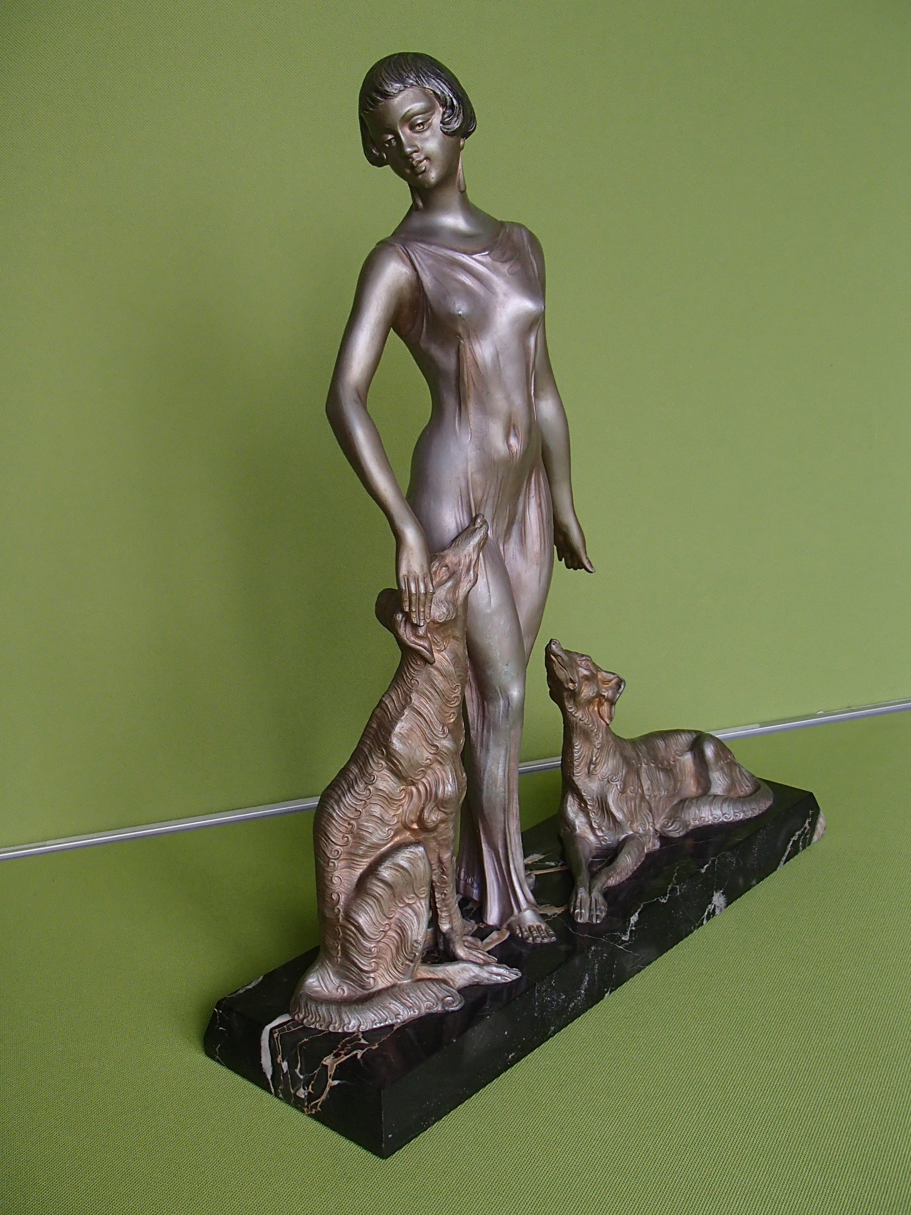 Very elegant Art Deco Lady in a satin evening dress that shows the beauty of her body with two Barsoi dogs on black marble by Limousin.