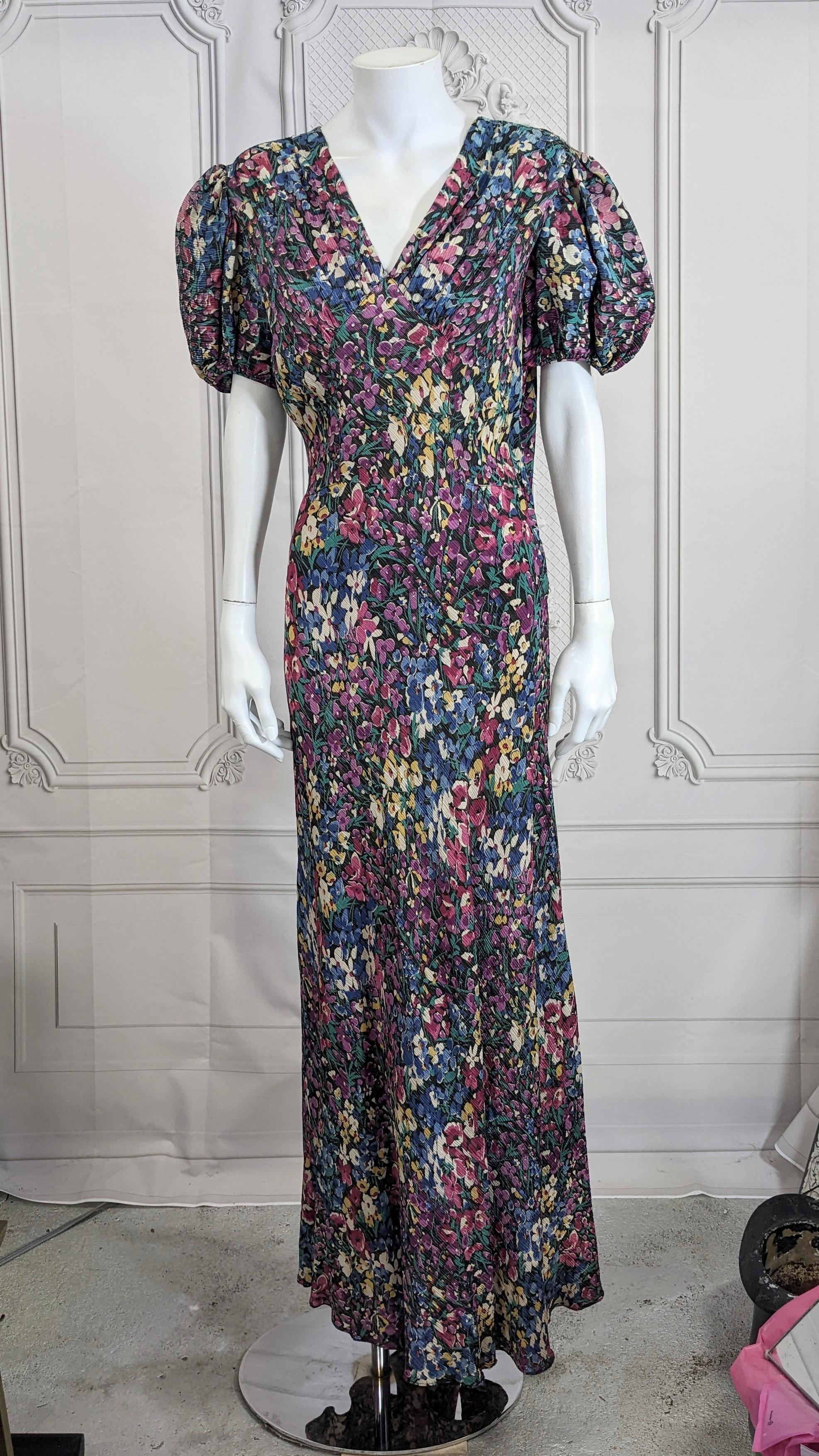 Elegant Art Deco Lame Floral Gown from the 1930's. Bias cut with very large puffed sleeves, slim cut bodice with lovely flared skirt. Gathers fall from shoulders to central yoke. Side snaps closure entry as well as 2 sets of back button closures.