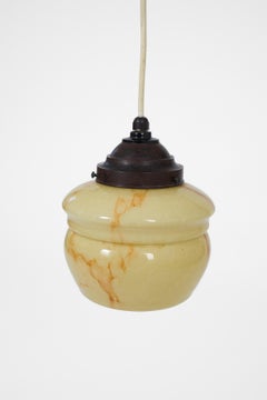 Elegant Art Deco pendant lamp featuring a softly shaped marbleized glass shade.
