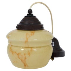 Elegant Art Deco pendant lamp featuring a softly shaped marbleized glass shade.