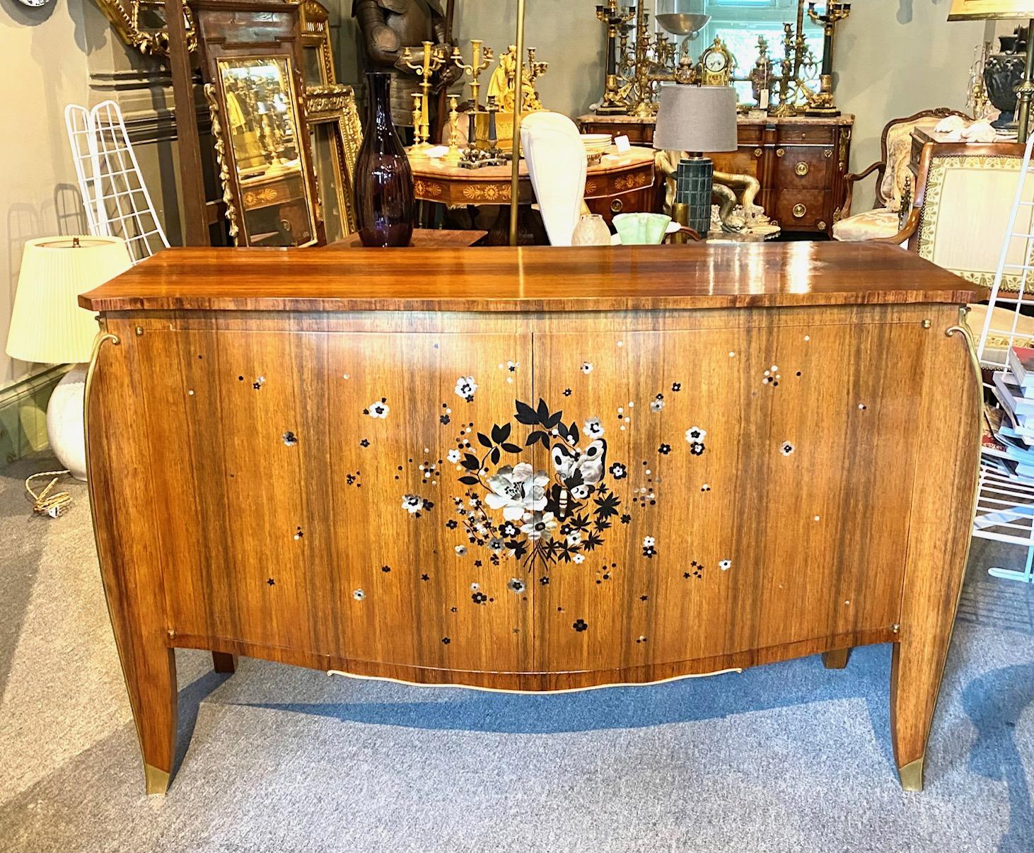 Elegant Art Deco Period palissander buffet by Jules Leleu inset with mother of pearl floral motifs and gilded bronze hoof feet