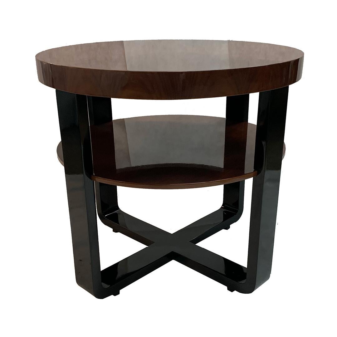 Elegant and simple Art Deco side table in solid mahogany and veneered in Rosewood in a semi-gloss finish. Legs in black piano lacquer.

Made in France, circa 1930.